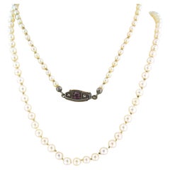 Vintage necklace of Pearl with a lock with ruby and diamonds 10k yellow gold and silver