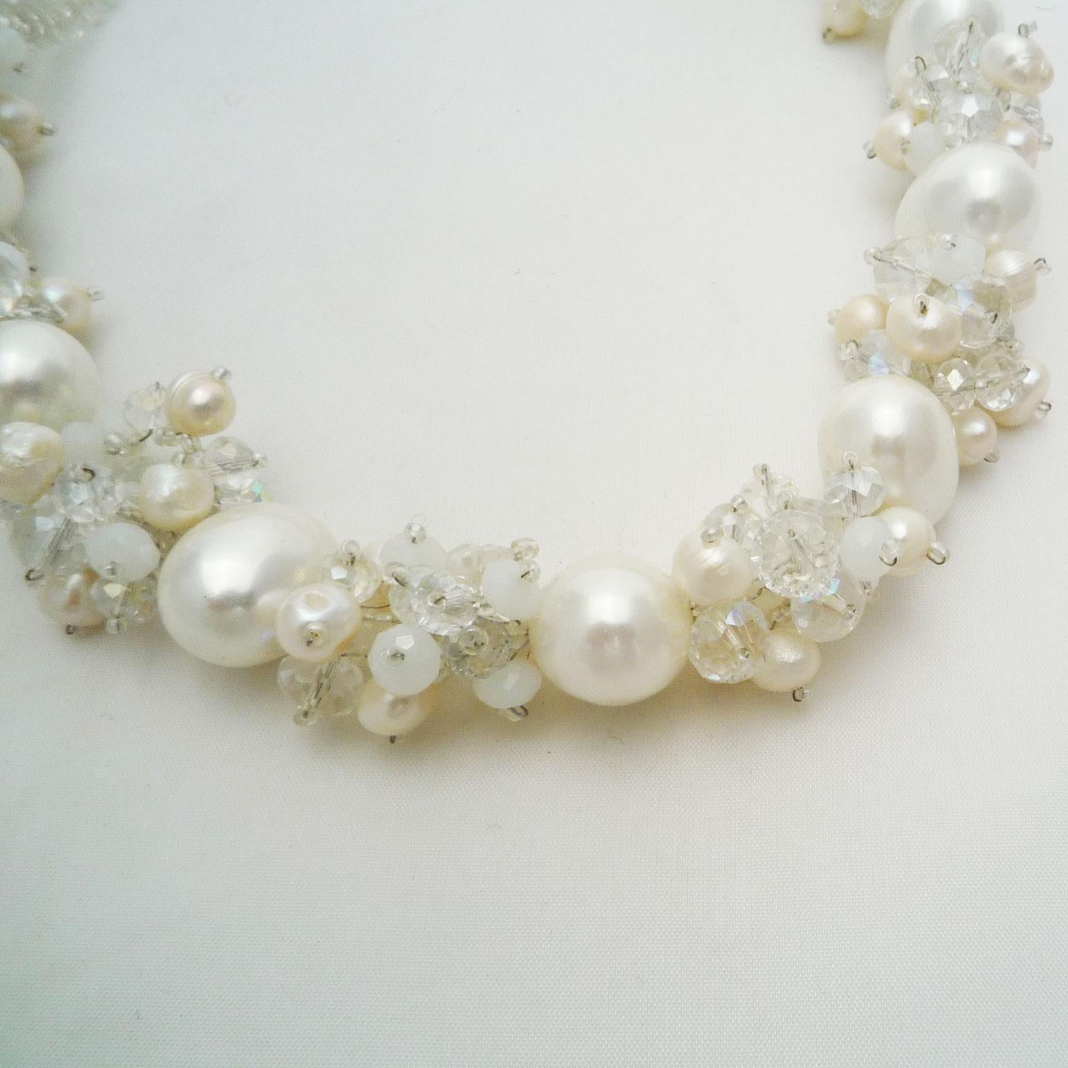 Necklace of Swarovski pearls and freshwater pearls 
Handmade chain in light color.

This necklace made of Swarovsky pearls was made of large pearls and smaller freshwater pearls artfully together. Hand knotted.
Modern design object.
Chain length 50