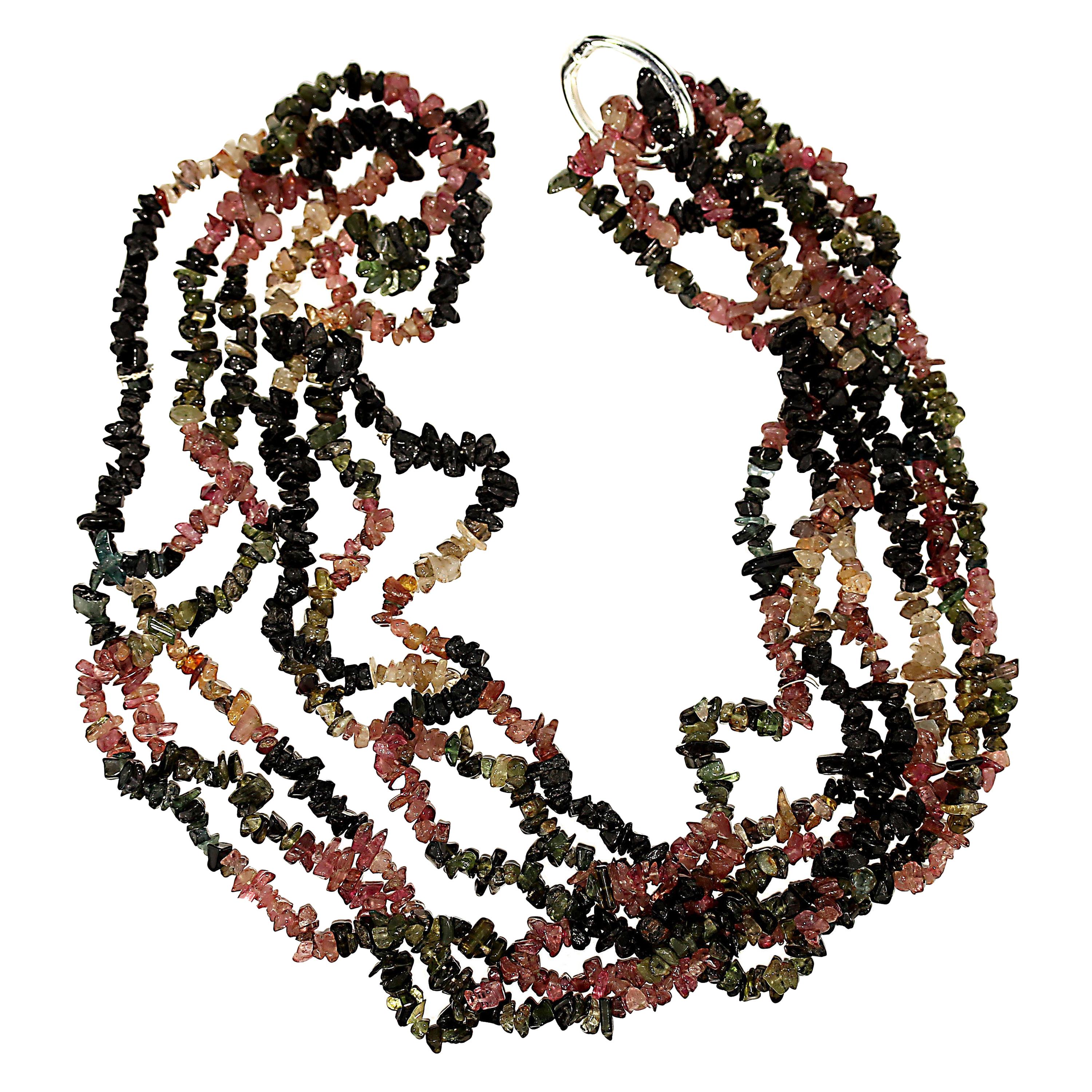 Continuous 34 inch multi color Tourmaline chips to wear in various ways.  Collect these around your neck and wear them long, double and secure in back with the silver tone clasp, tie in front to create a spectacular focal, etc, etc.  I'll leave it