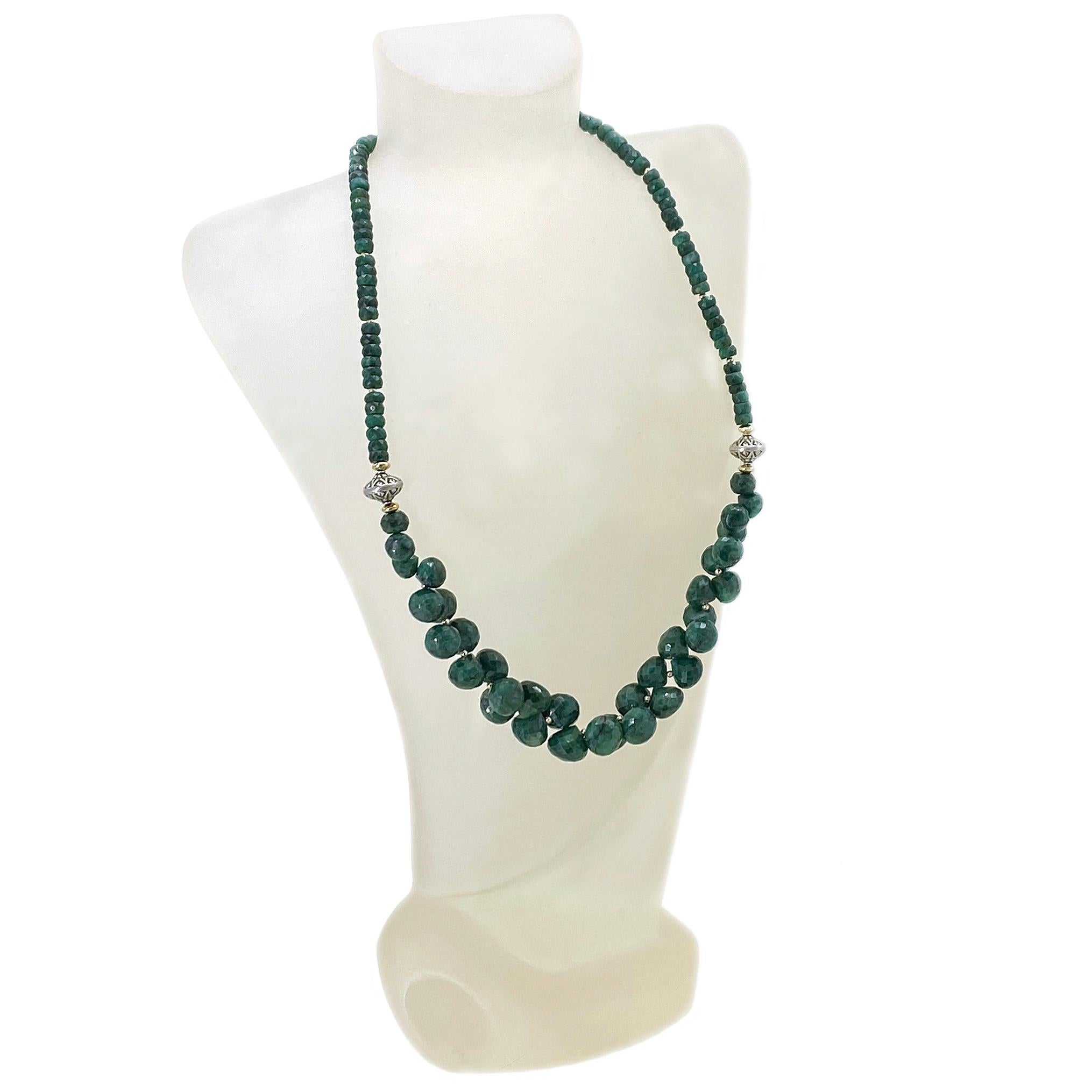 We created this *Green Ruby necklace with up to 11 mm faceted candy kiss cut gems, 5 mm faceted rondels and 14K gold filled findings. It's decorated with two Bali sterling silver beads and a small toggle clasp.

*Ruby Zoisite, also known as Anyolite