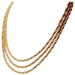 Collier avec 3 importantes cordes torsadées en or jaune 18 carats