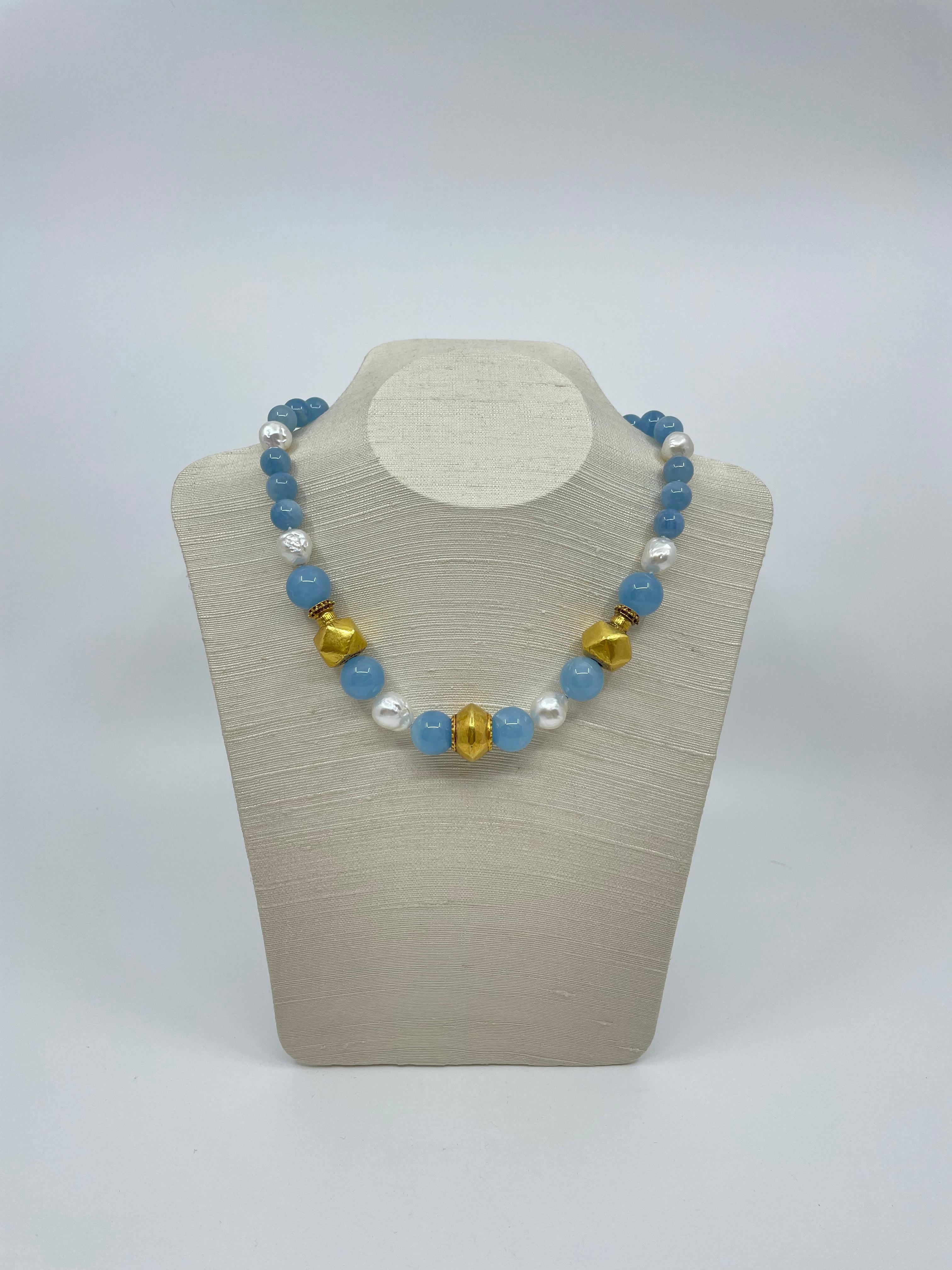 From our Amalfi collection, an exquisite hand-made necklace enchased with a set of three gold beads spaced by round soft blue aquamarine beads, South Sea pearls and 18K gold faceted beads, stunning for all occasions.

The Amalfi Collection
Evoking