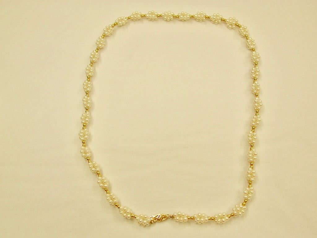 Necklace with Clusters of Bouton shaped Cultered pearls, with matching bracelet, 14ct gold snaps
Necklace:- 20.5 inches long ,interspersed with 2 golden balls between each cluster
Bracelet to match 7.5 inches long, made in the 1980's