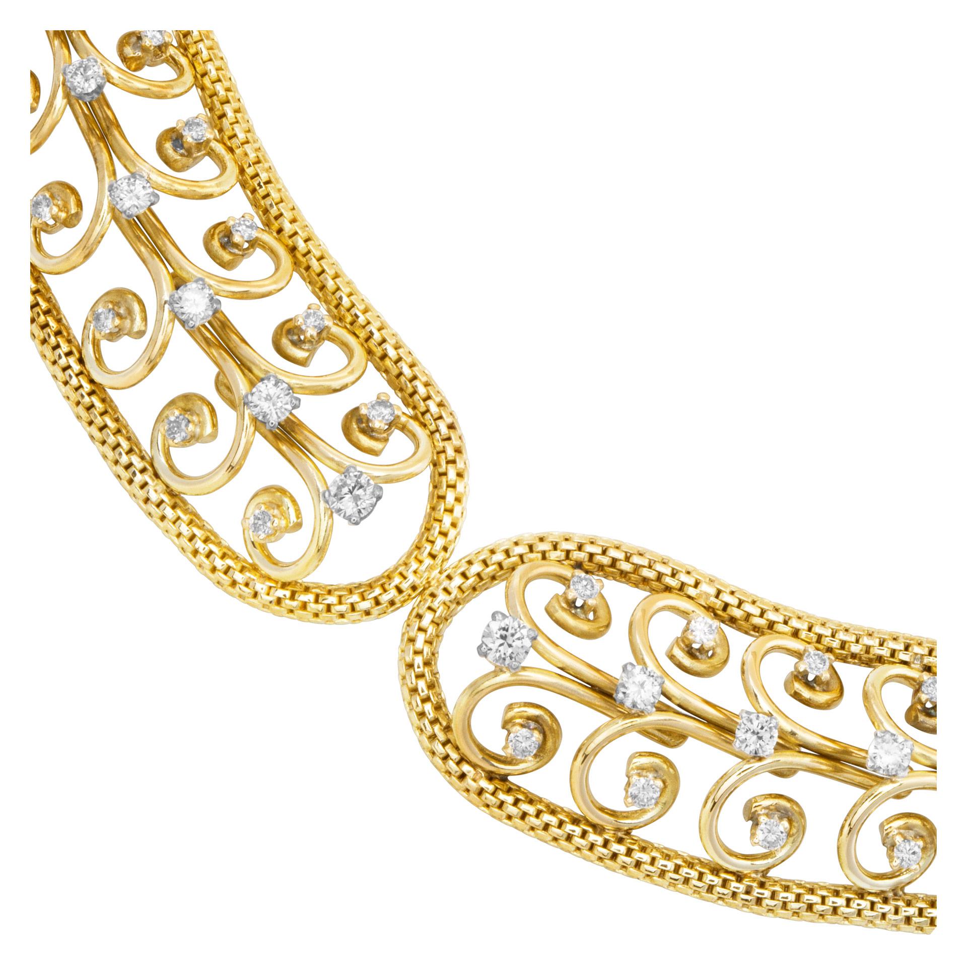 Swirl link choker necklace with over 1 carat in G-H color, VS clarity diamond accents set in 18k yellow gold. 14.5