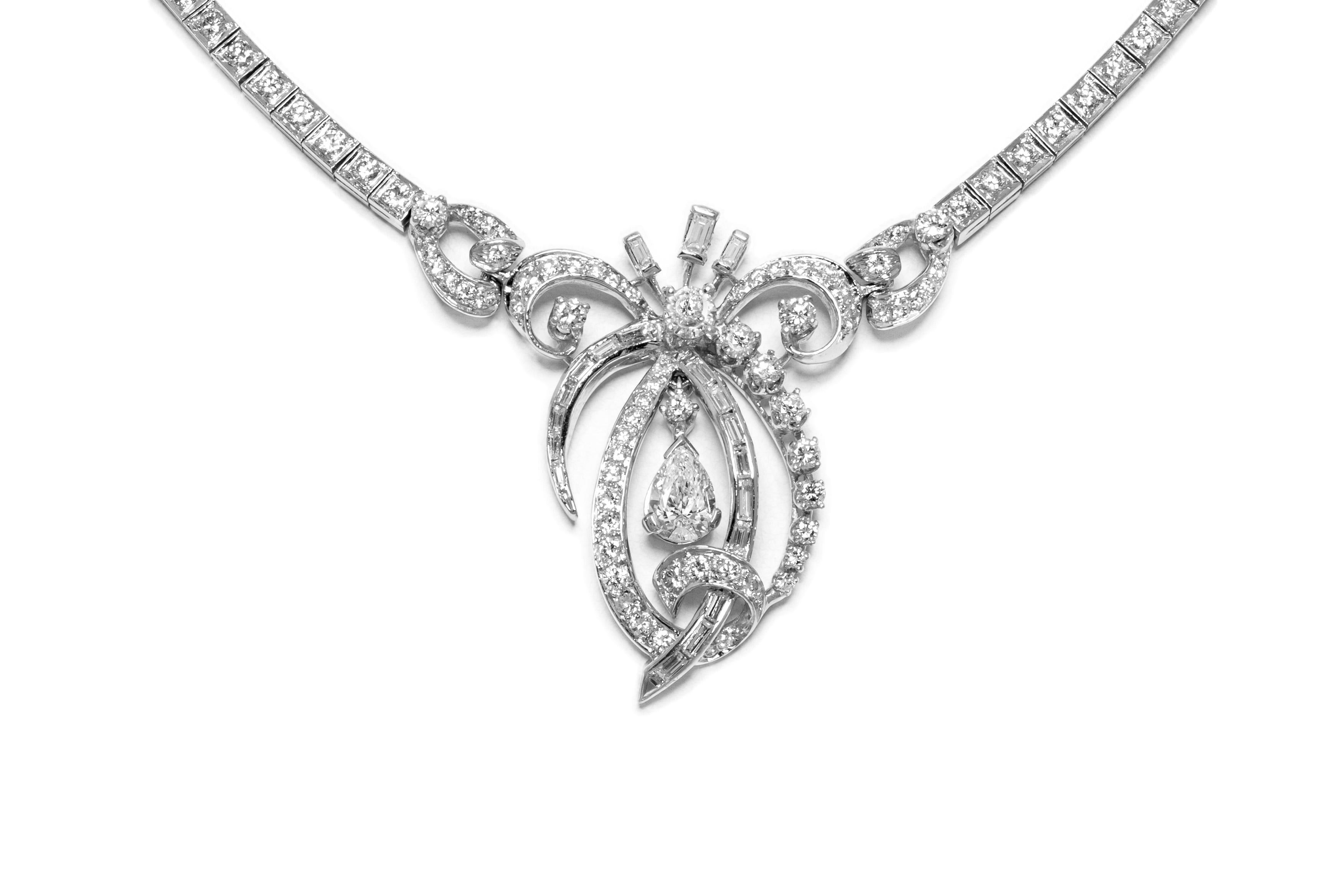 Necklace, finely crafted in platinum with a diamond pendant weighing approximately a total of 11.00 carat. The length of open necklace is 17 inch. Circa 1930's.