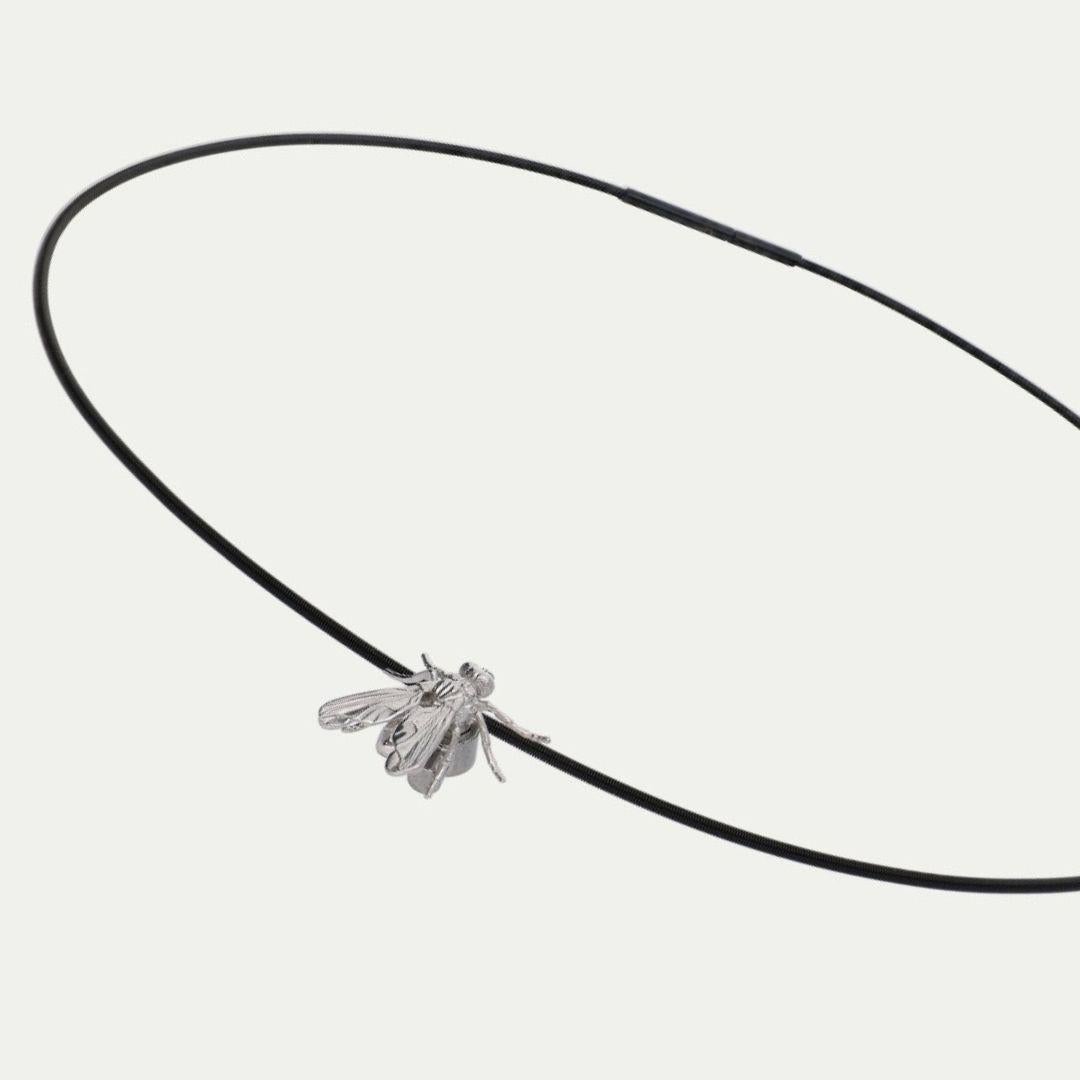 Product recommended by Tan France
- 18K White Gold Insect
- Elastic Necklace in black or white color

You can mount or dismount the Necklace Fly. The ECH surgical steel screwing system allows you to easily and reliably mount decorative elements on