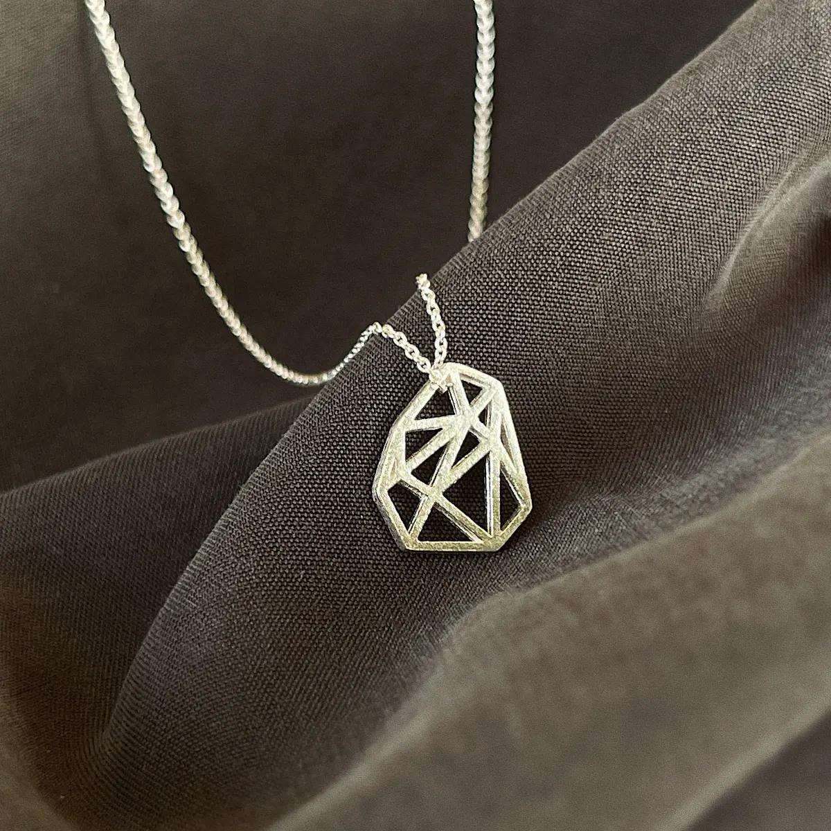 Polygon-shaped pendant from this necklace has a special meaning for us. It resembles a mineral shard, a symbol of Kamena. This necklace would perfect for you if you love subtle accessories.
The necklace is made of 925 sterling silver. 
The length of