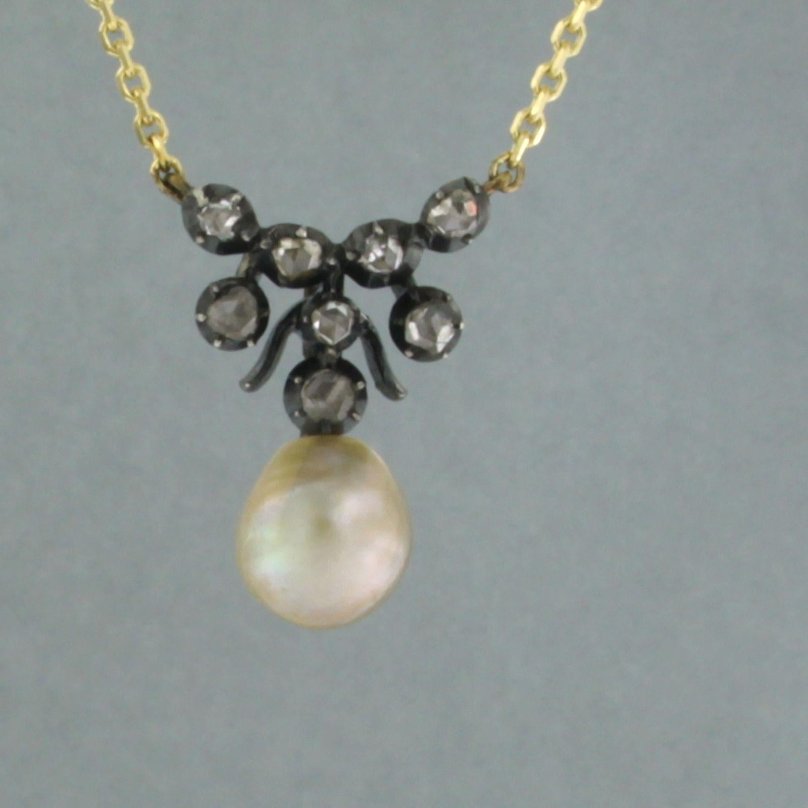 14k gold necklace with a gold and silver centerpiece set with pearl and rose diamond up to 0.20ct - G/H - SI -44 cm long

detailed description:

the necklace is 44 cm long and 0.7 mm wide

the size of the centerpiece is 2.0 cm long by 1.5 cm wide,