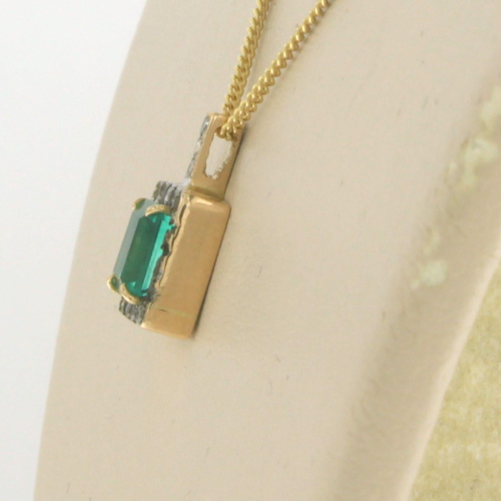 Modern Necklace with pendant set with emerald and diamond 14k yellow gold