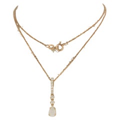 Necklace with pendant set with opal and diamonds 14k pink gold