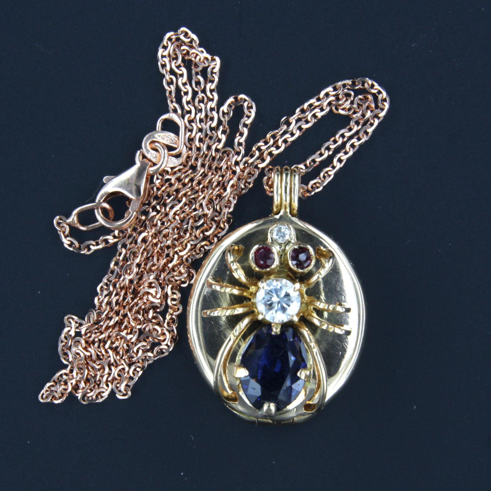 18k pink gold necklace with an 14k pink gold pendant set with ruby, sapphire and brilliant cut diamond. 0.20ct - F/G - SI - 45 cm long

necklace is 45 cm long and 0.7 mm wide

size of the pendant is approximately 2.3 cm by 1.6 cm

pendant is also a