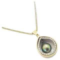 Necklace with Tahitian pearl in gold with diamonds