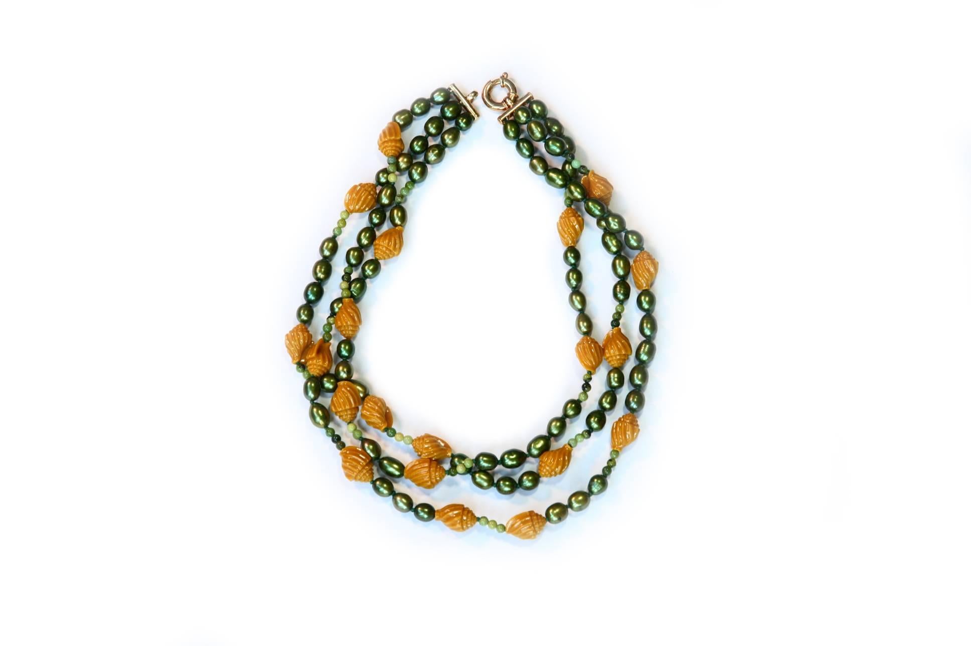 Necklace with carved yellow coral shells green fresh water pearls amazonite.
Total length 46cm gold plated.
All Giulia Colussi jewelry is new and has never been previously owned or worn. Each item will arrive at your door beautifully gift wrapped in