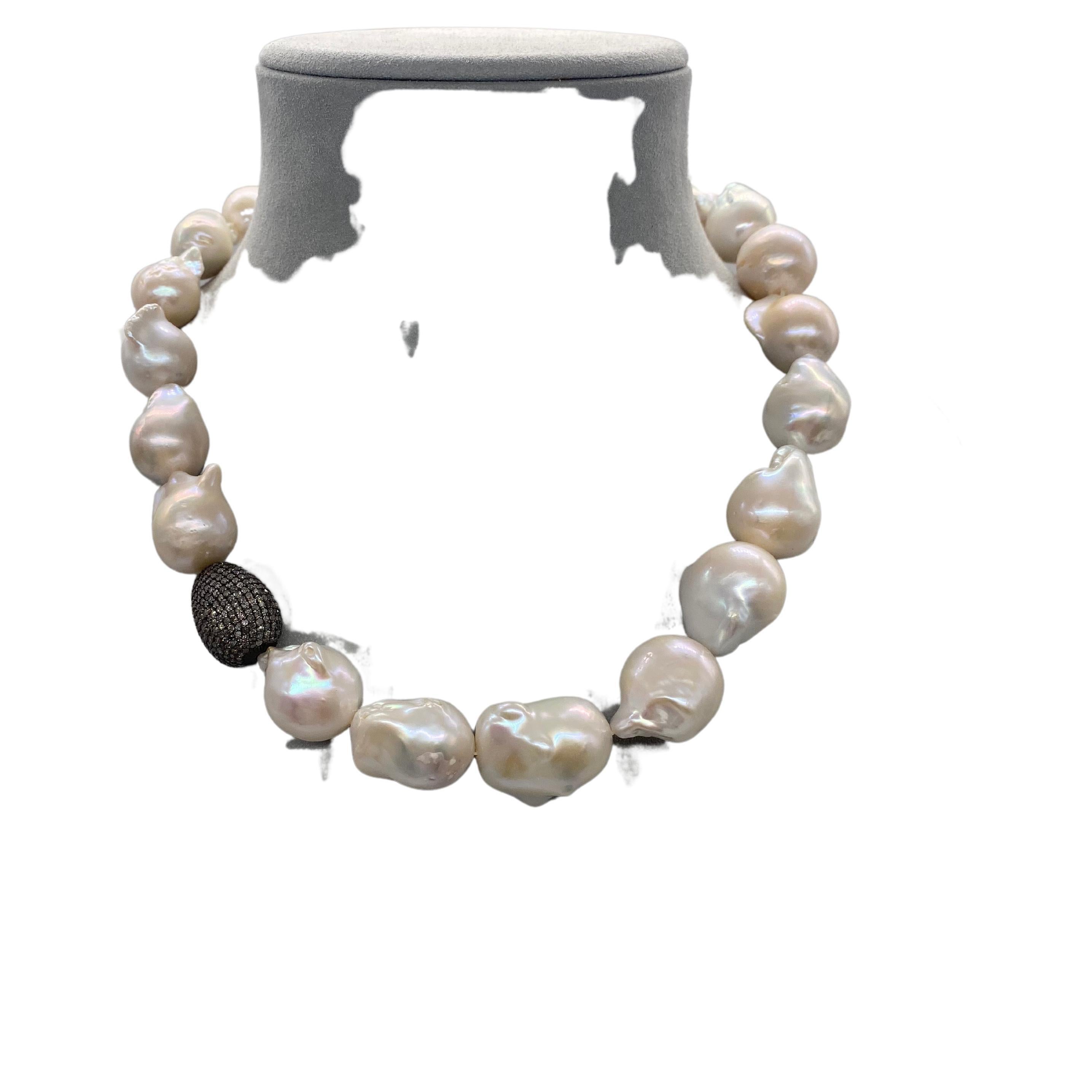 Baroque pearls come from the South Seas, where nature creates underwater treasures of striking beauty. Their soft, organic irregular shape adds a captivating dimension to these necklaces. The iridescence of the pearls gracefully reflects the full