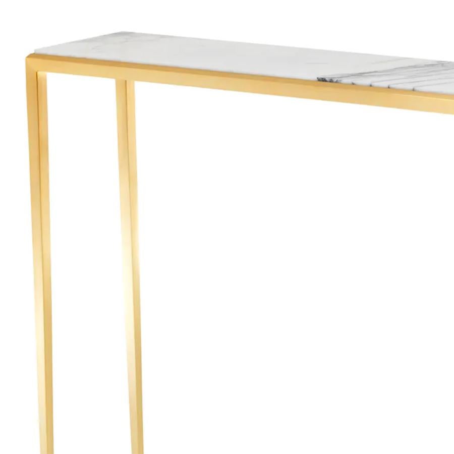 Console Table Gold Needle with structure in
steel in gold finish and with white marble top.
Marble's veins change depending on the block 
of marble from which the top is cut. Each top is 
a little different but the quality of the marble.
Also