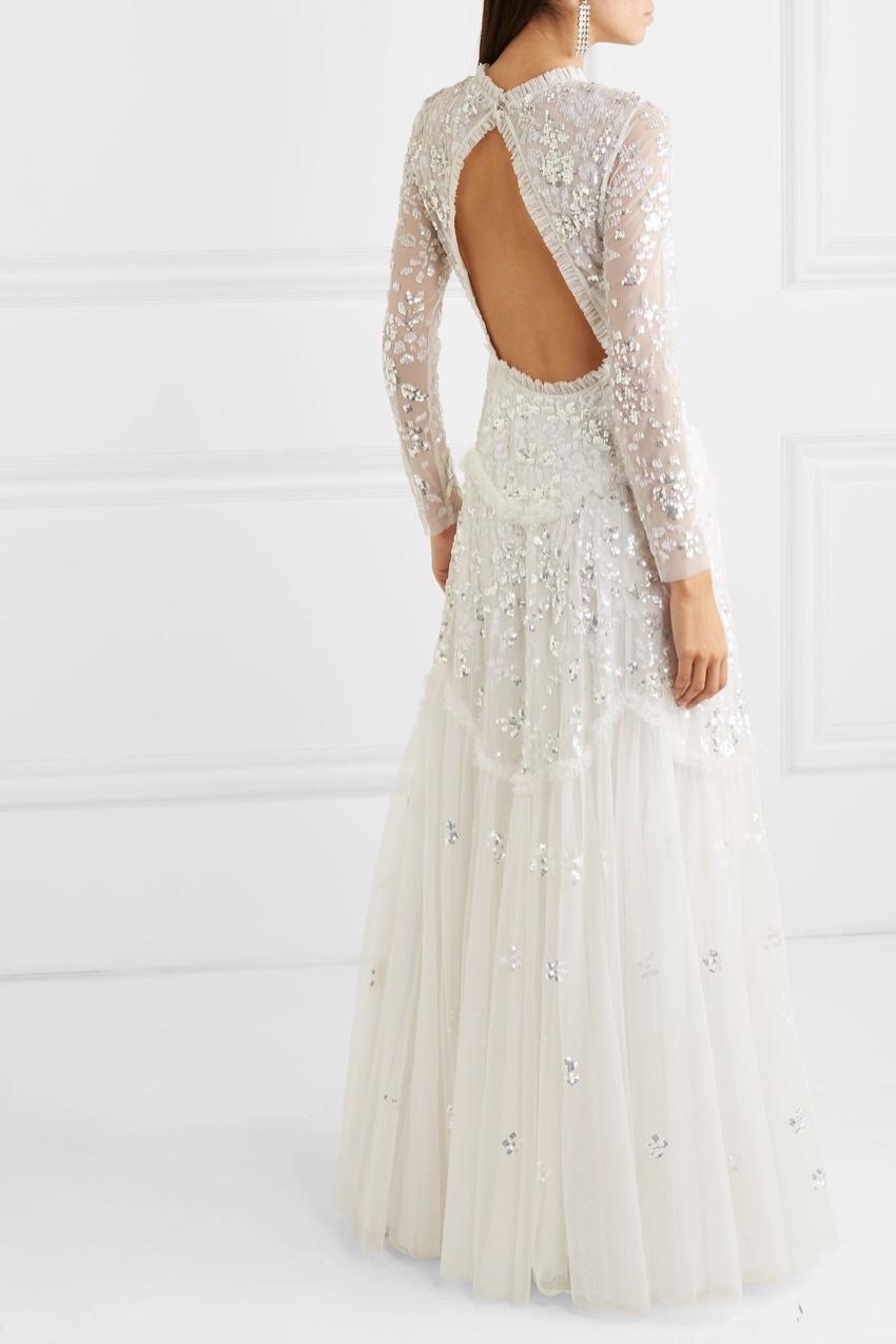 Needle & Thread Ivory Mesh & Sequins Bridal Gown

Needle & Thread's ivory tulle gown has a fitted bodice and tiered skirt that'll move beautifully as you walk down the aisle. The open back deserves to be shown off, so it's a perfect option for