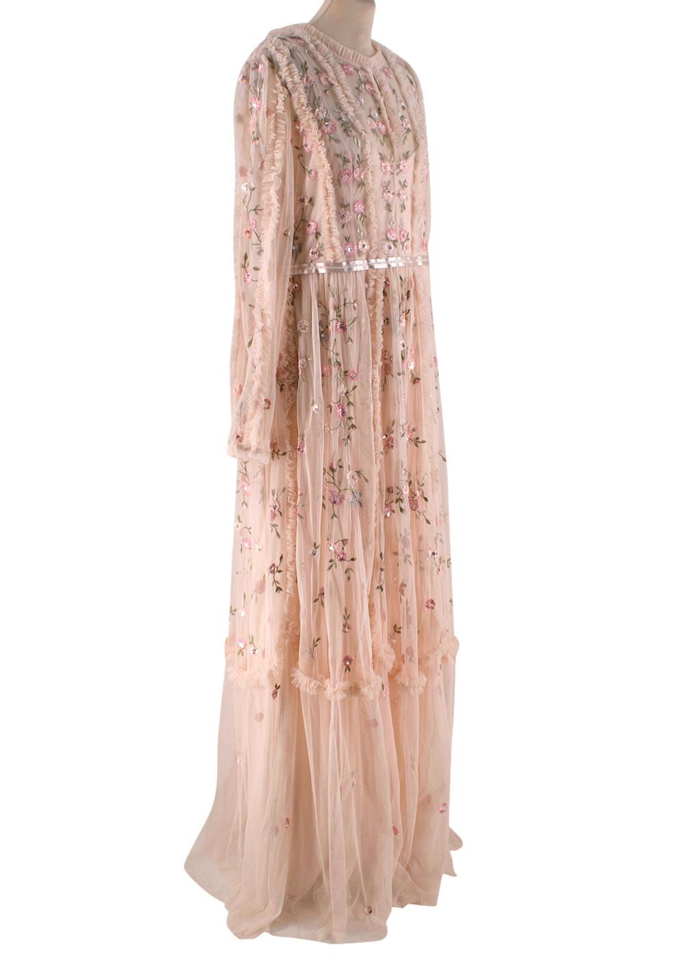 Needle & Thread Pink Mesh Wallflower Gown 

-Round neckline
-Long raglan sleeves
-Elasticated cuffs
-All-over frilled applique
-All-over floral embroidery
-Fully lined with a slip style undergarment 
-Concealed zip fastening to the