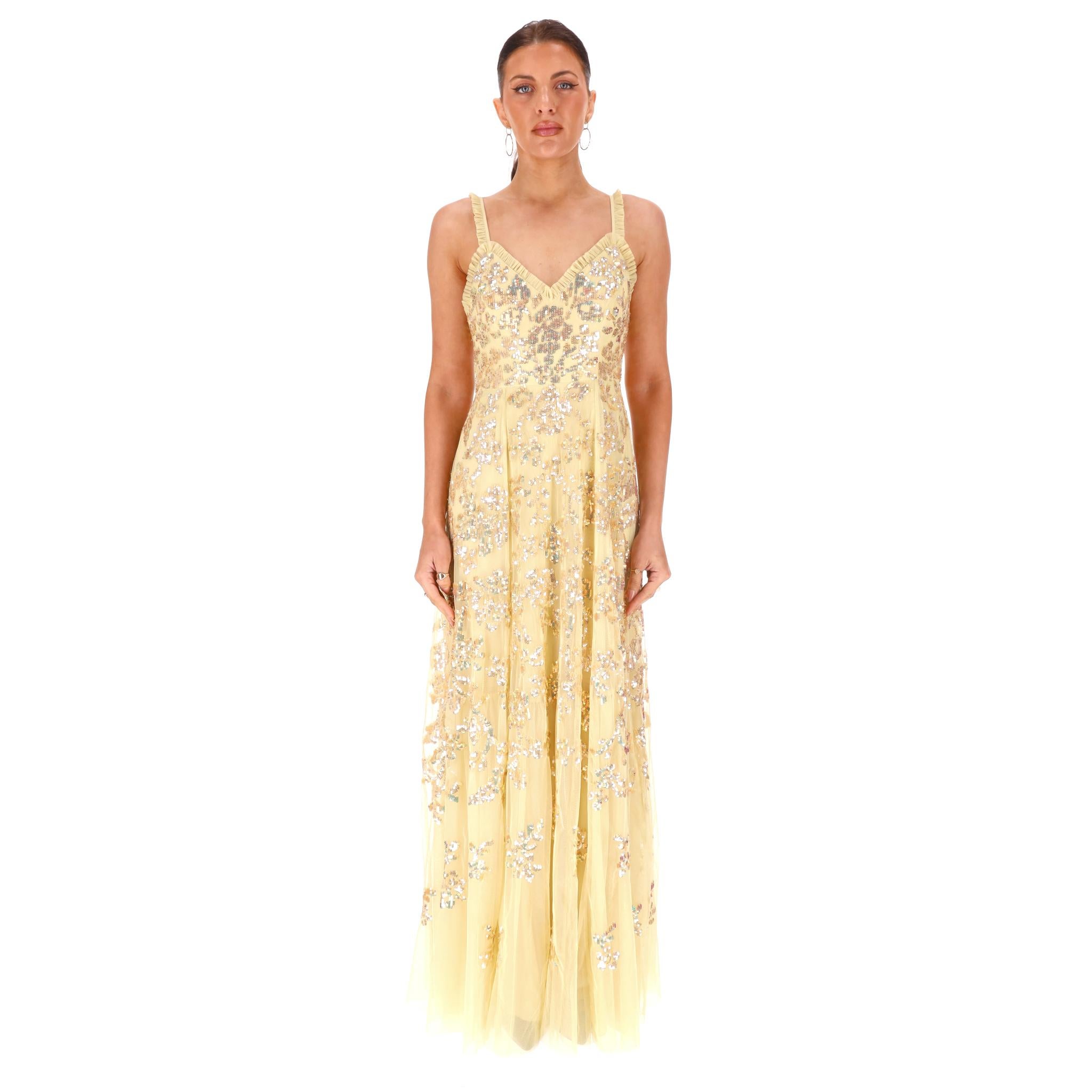 We Adore - Needle & Thread Sequin Embellished Evening Dress/Gown

Light yellow 'Valentina' dress crafted from layered tulle adorned with metallic gold sequin embellishment.

Featuring frilled trimmed spaghetti straps and V-neck.

Fitted bodice with