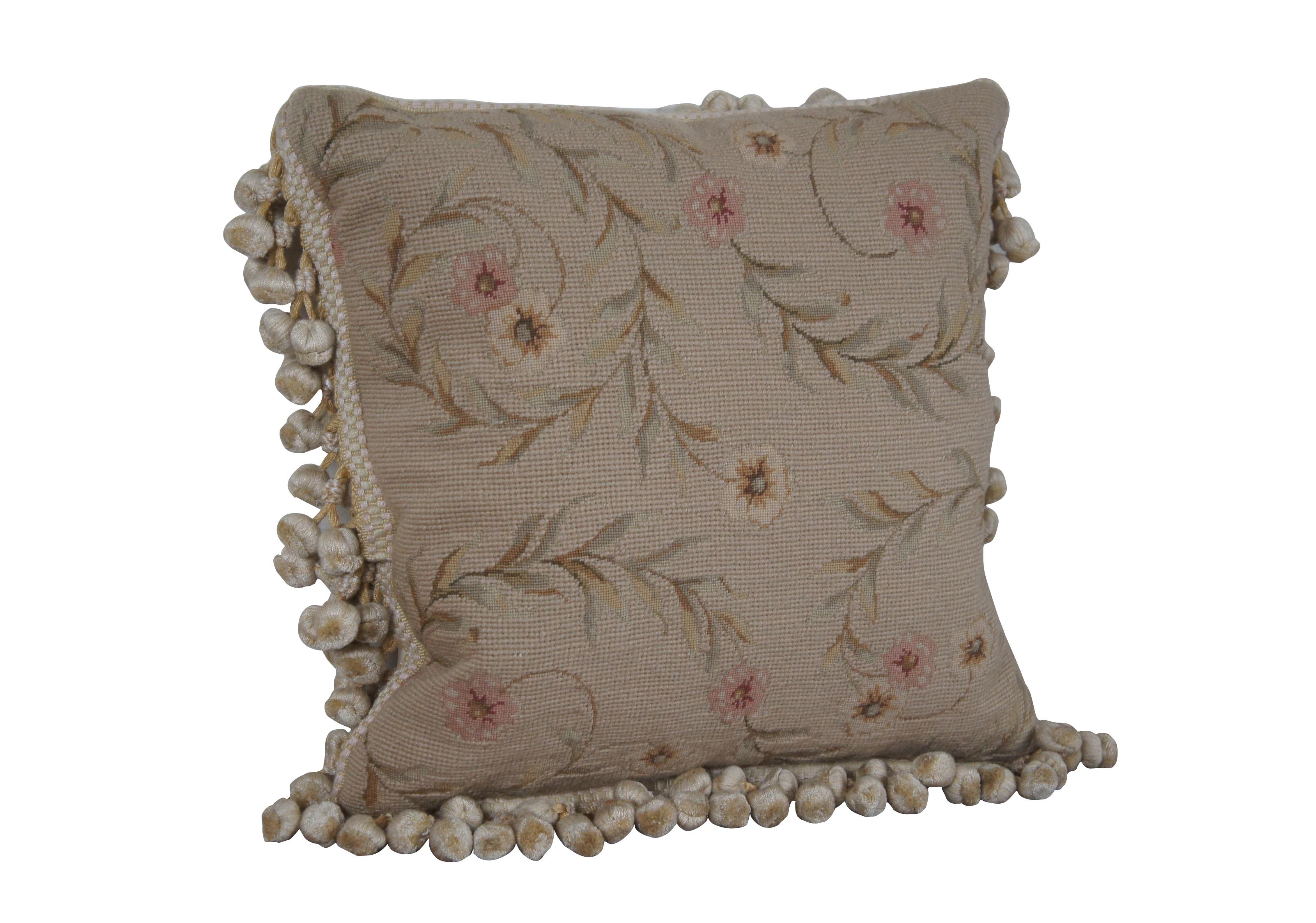20th century square throw pillow, hand embroidered with pink and cream flowers on spiraling leafy stems, over a beige background. Cream and gold ball tassel trim. Cream velour back with zipper closure. Down filled.

Dimensions:
16