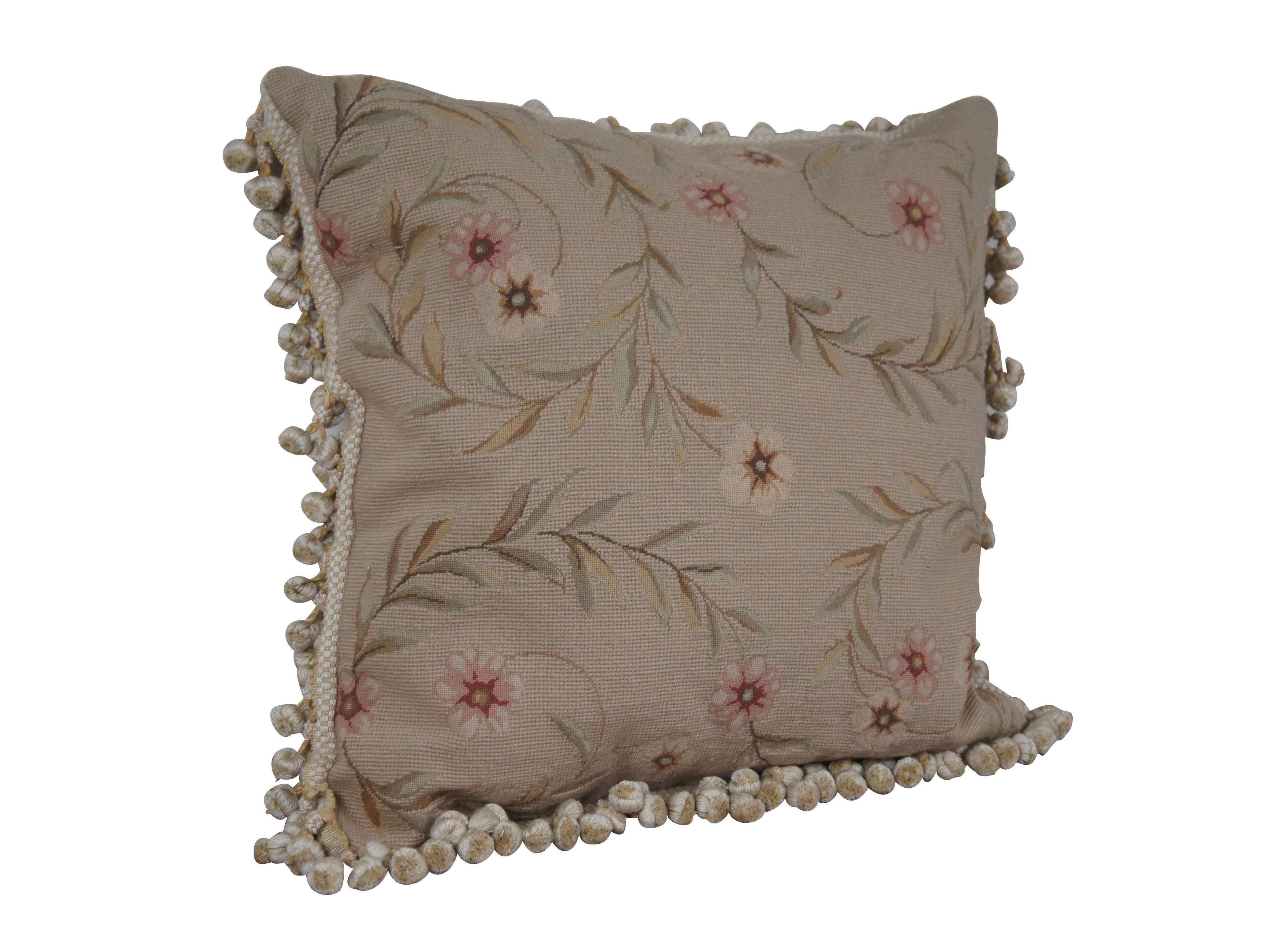 20th century square throw pillow, hand embroidered with pink and cream flowers on spiraling leafy stems, over a beige background. Cream and gold ball tassel trim. Cream velour back with zipper closure. Down filled.

Dimensions:
22