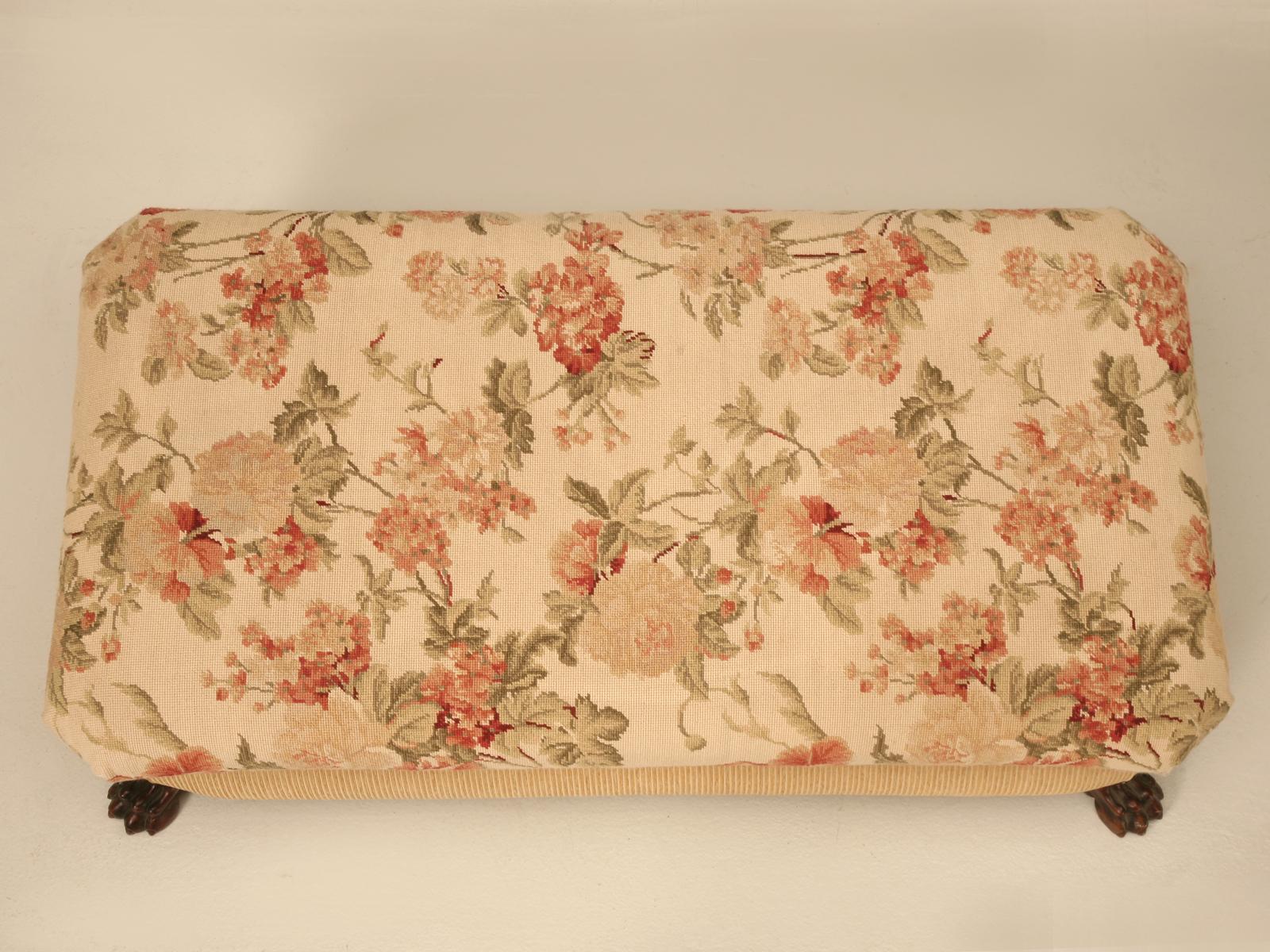 Ottoman, handmade in England.
Large rectangular ottoman with lion claw feet, with exquisite needlepoint upholstery. Perfectly suited to use as a coffee table in front of the sofa without worrying about putting your feet up. Top lifts to reveal