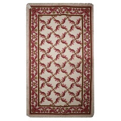 Tapis traditionnel oriental en laine rose tissé à la main à l'aiguille