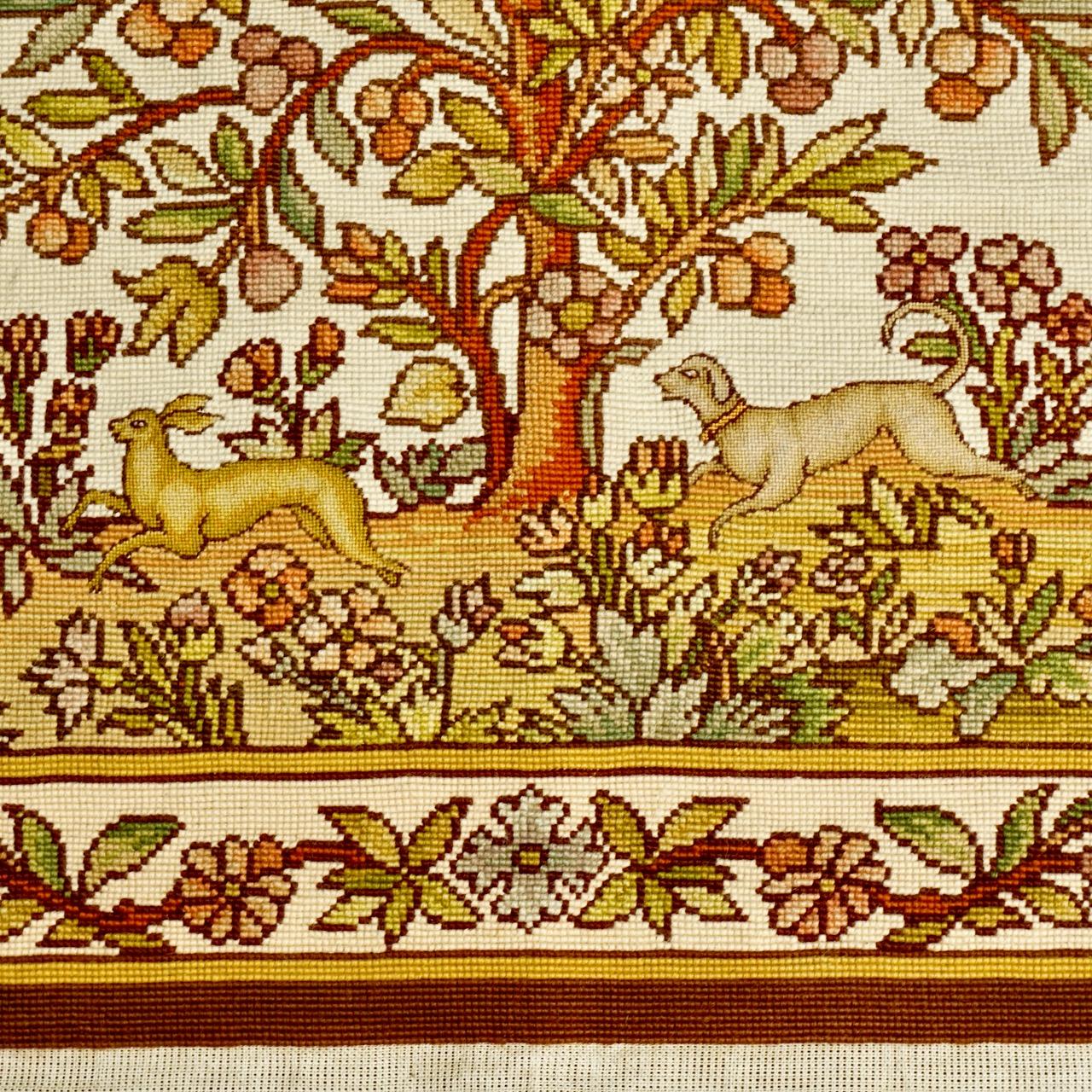 
Beautiful needlepoint tapestry with a medieval style design in warm colours. Featuring a fruit tree with a bird, flowers, and a dog chasing a rabbit. The tapestry is hand crafted. The piece measures width 78.5 cm / 30.9 inches by length 75 cm /