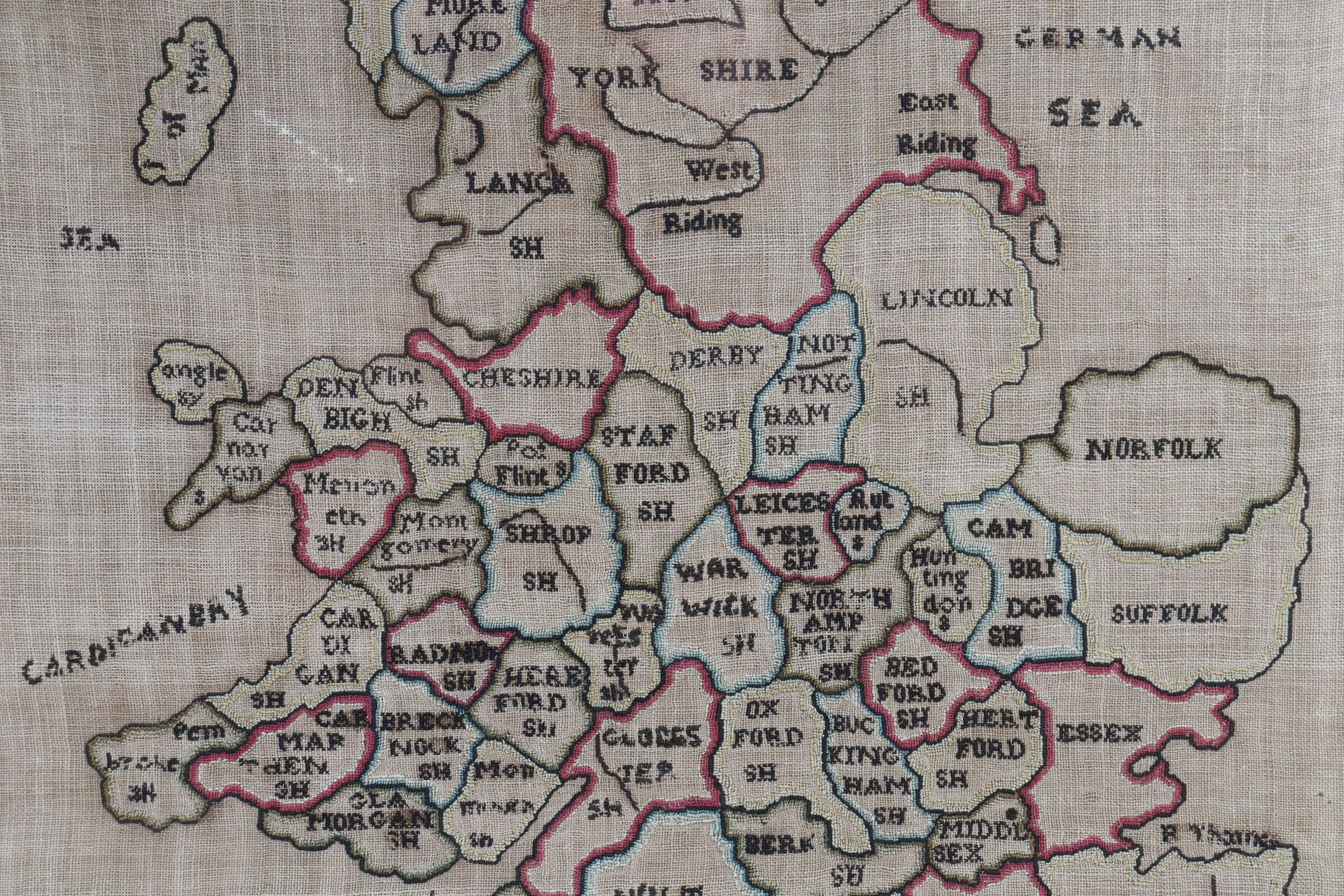 A lovely needlework map of England and Wales, showing the counties as they were in the late 1700's. It also shows the partial coastlines of Ireland, France and Scotland together with the names of various maritime areas such as the Irish Sea, the