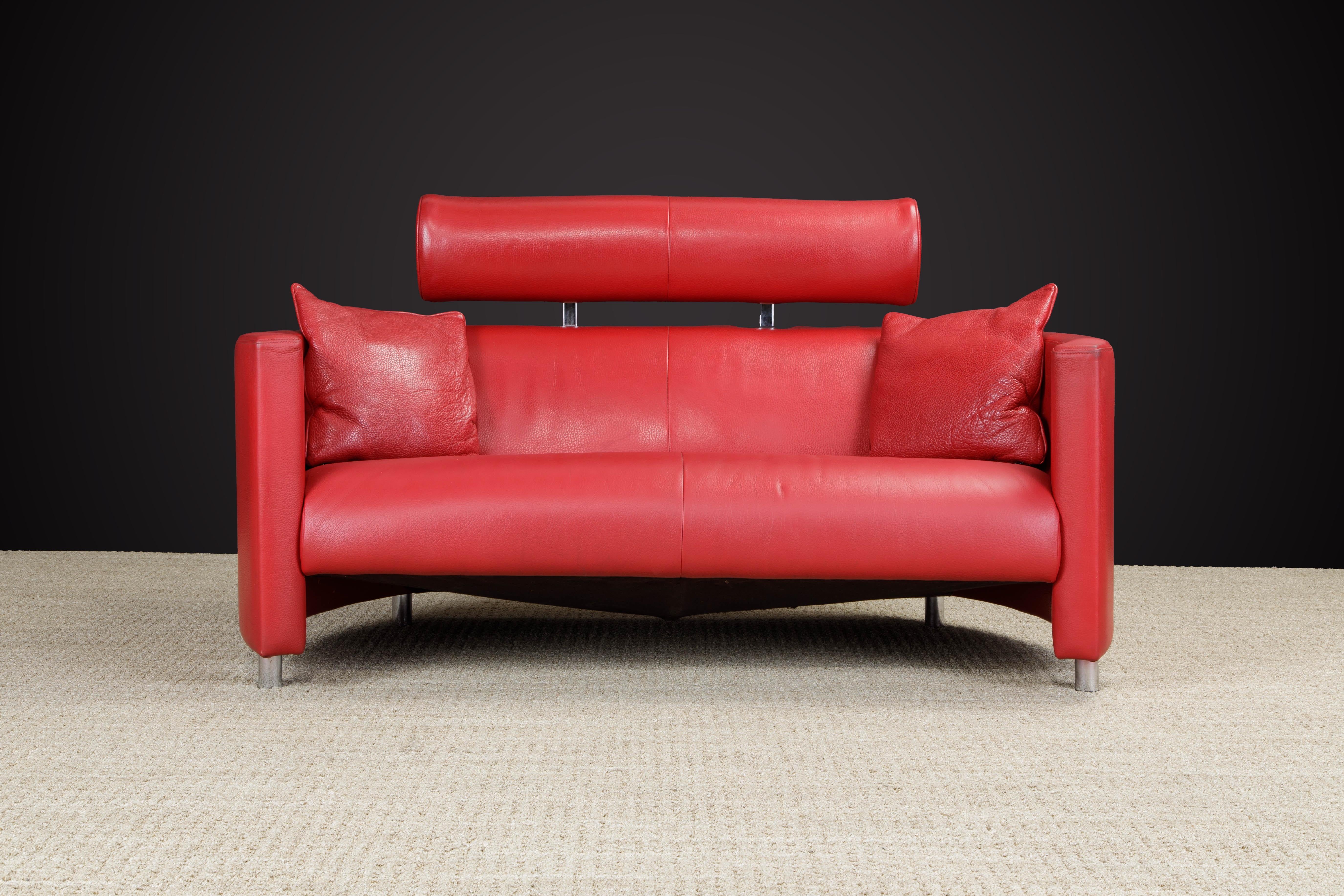 This beautiful red leather Post-Modern loveseat sofa designed by Bernard Massot and produced by Massot, France in circa 1980s/90s. 

Featuring gorgeous red pebbled leather wrapped around the sensual curved sides with chrome-plated steel legs, the