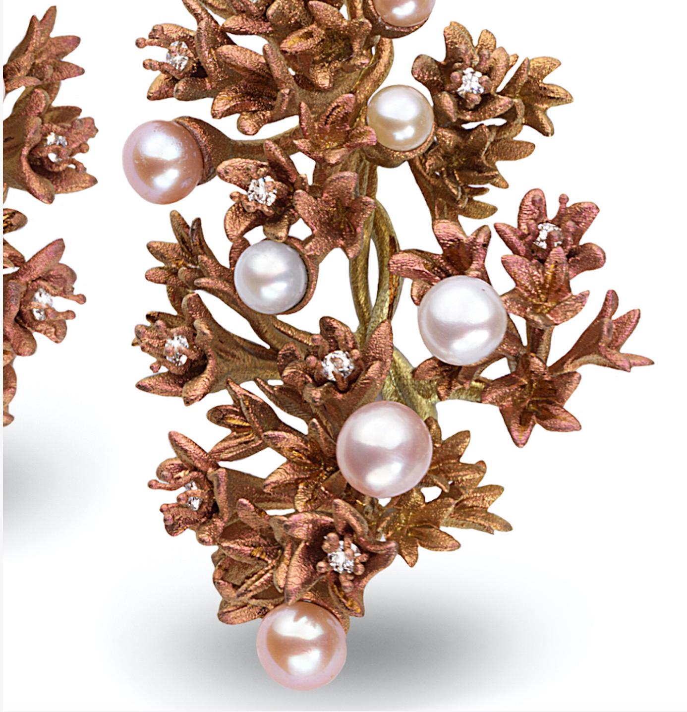 A pair of modern Fiorella earrings by Neha Dani. These titanium earrings are comprised of two significant hanging bouquets of delicately twisting and unfurling bronze-colored blooms, interspersed with 18 freshwater pearls and 20 round-cut diamonds