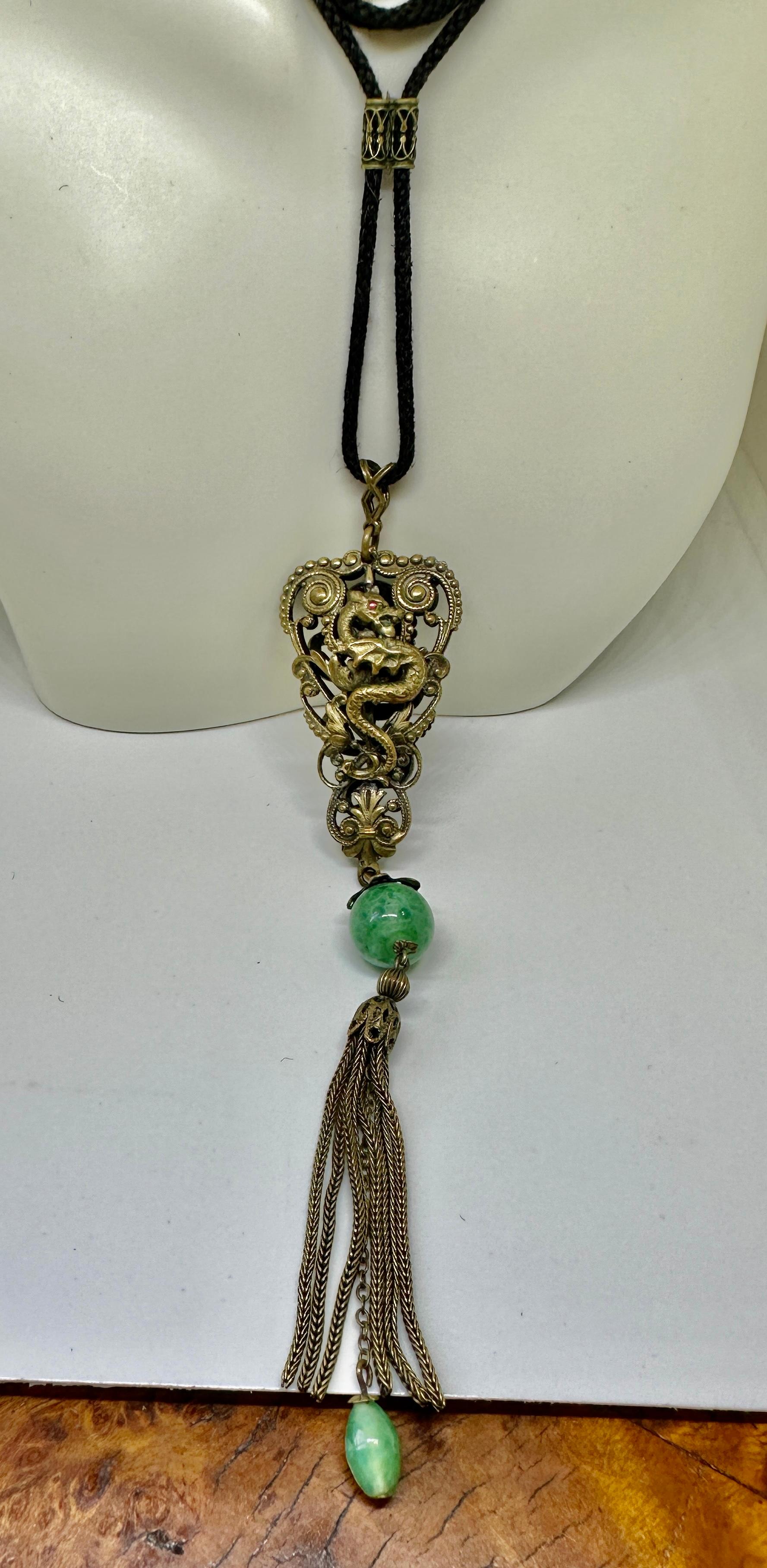 This is an absolutely incredible Czech Neiger Brothers Snake and Seahorse Dragon Egyptian Revival Art Glass Pendant Necklace dating to the Art Nouveau period.  The fabulous Max Neiger jewel from Czechoslovakia made at the turn of the century has