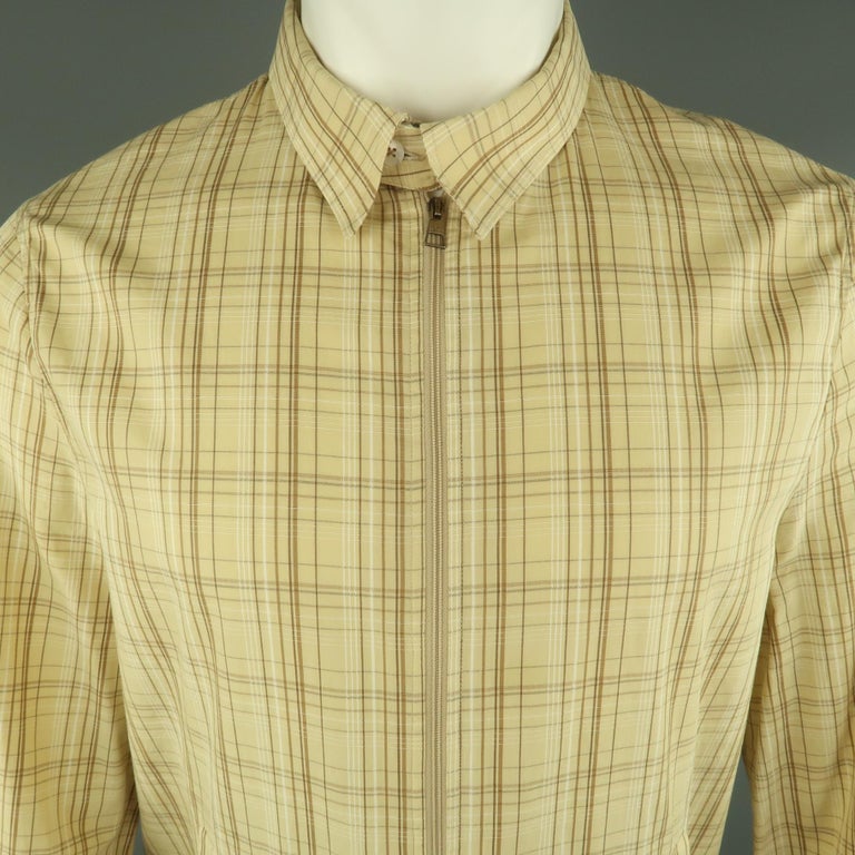 NEIL BARRETT Jacket comes in khaki tones in a plaid material, with slit pockets, buttoned cuffs and detachable zipped collar, unlined. Made in Italy.
 
Excellent Pre-Owned Condition.
Marked: M
 
Measurements:
 
Shoulder: 17.5 in.
Chest: 44