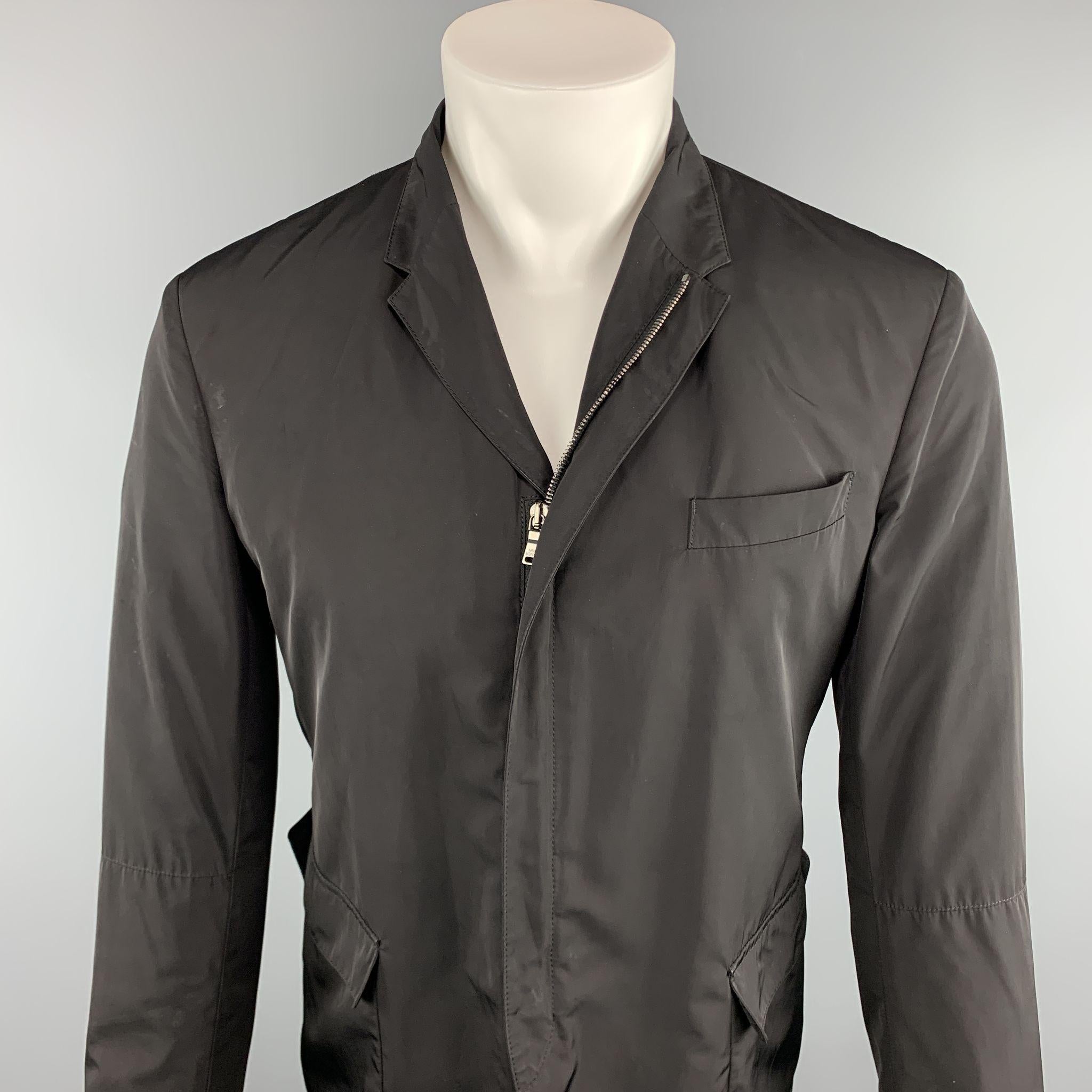 NEIL BARRETT Jacket comes in a black polyester featuring a slim fit,  front flap pockets, and a full zip closure. Made in Italy.

Excellent Pre-Owned Condition.
Marked: 48 

Measurements:

Shoulder: 17 in. 
Chest: 38 in.
Sleeve: 25 in. 
Length: 27