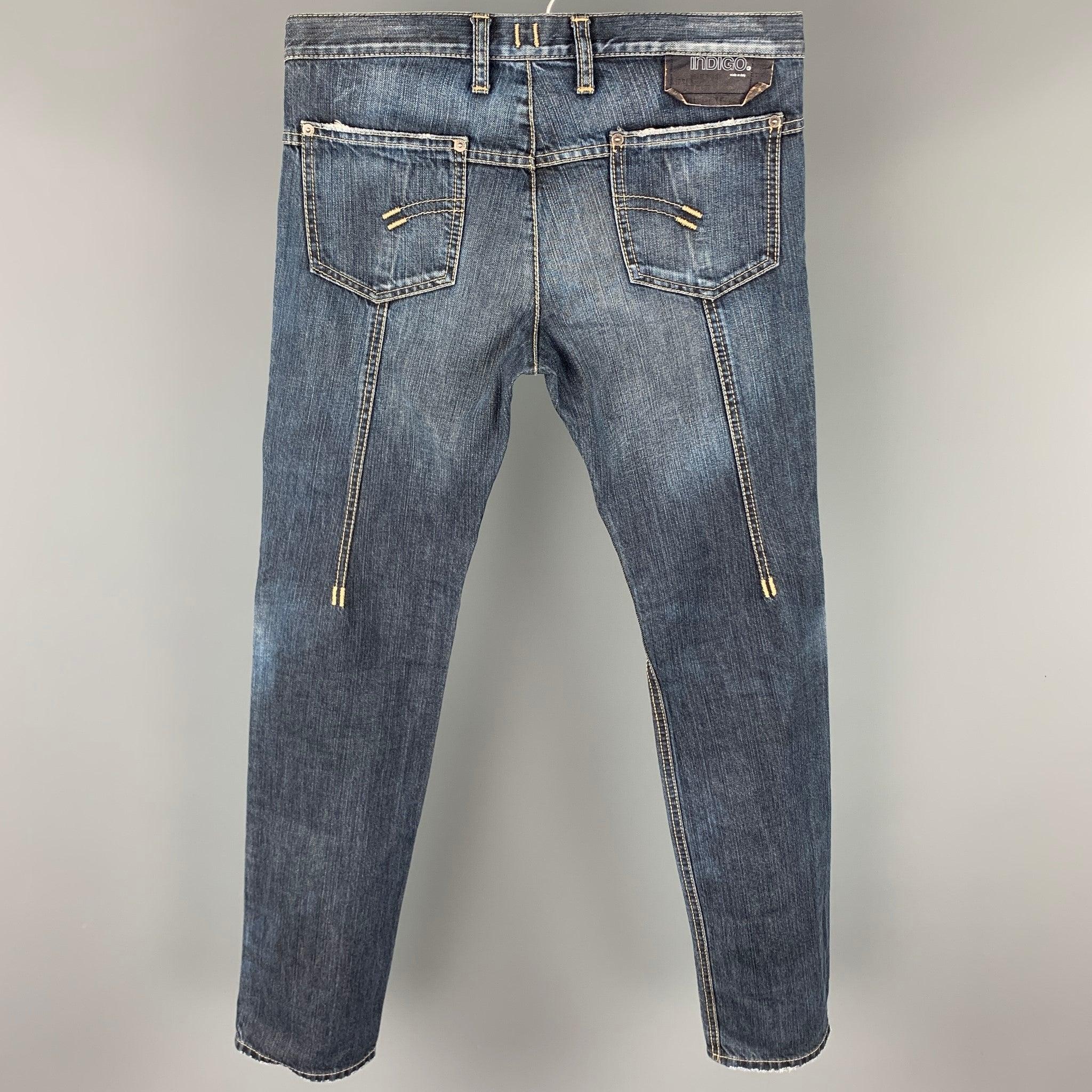 NEIL BARRETT jeans comes in a indigo denim with contrast stitching featuring a slim fit, zipper pocket, and a button fly closure. Made in Italy. Very Good
Pre-Owned Condition. 

Marked:   30 

Measurements: 
  Waist: 32 inches  Rise: 9.5 inches 