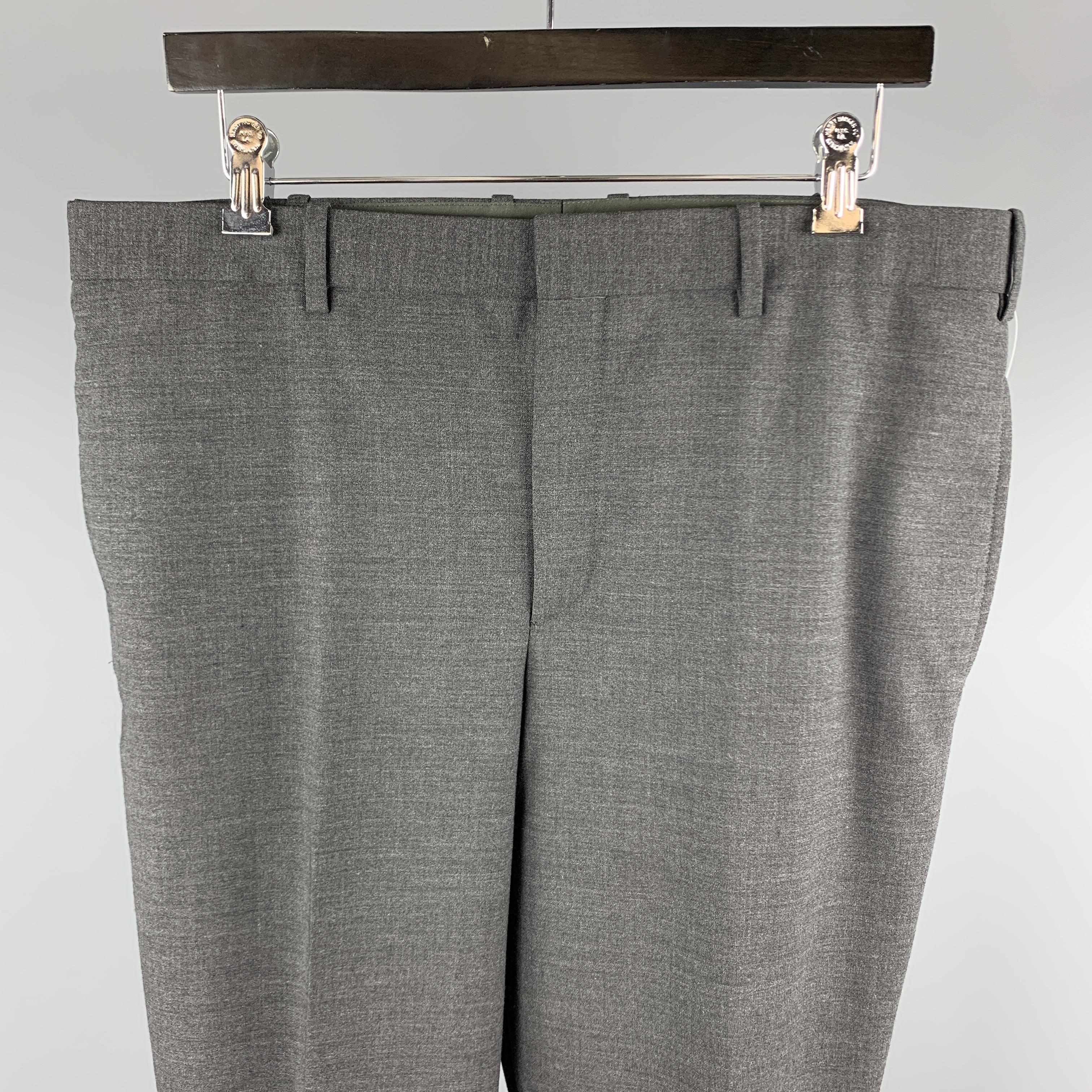 NEIL BARRETT tuxedo dress pants comes in a dark gray polyester blend featuring a skinny fit, regular rise, bottom leg zippers, and a zip fly closure. Made in Italy.

Excellent Pre-Owned Condition.
Marked: IT 52

Measurements:

Waist: 36 in. 
Rise: