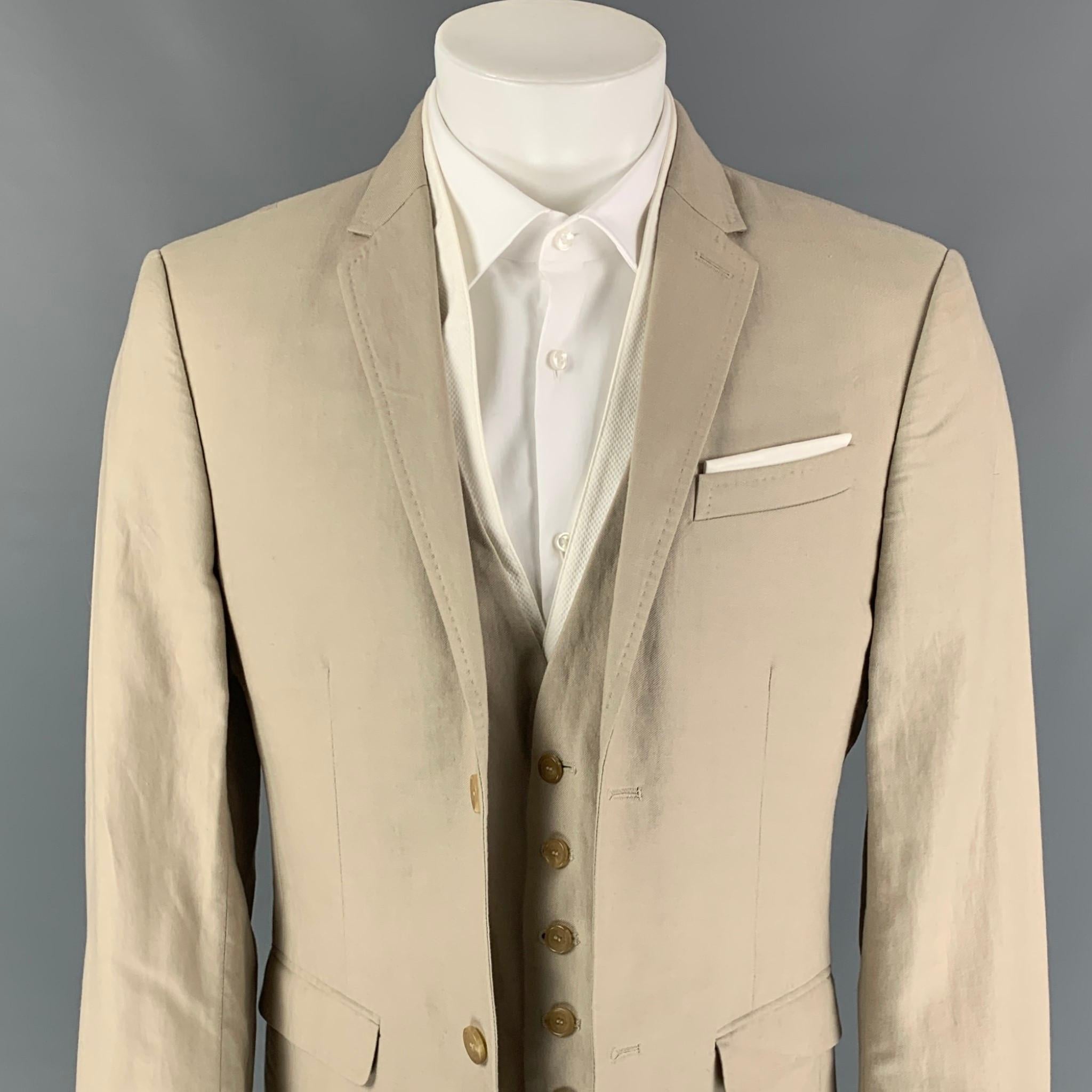 NEIL BARRETT sport coat comes in a khaki & white cotton / linen featuring a simulated vest layer, notch lapel, flap pockets, and a buttoned closure. Made in Italy. 

Very Good Pre-Owned Condition.
Marked: 50

Measurements:

Shoulder: 18 in.
Chest: