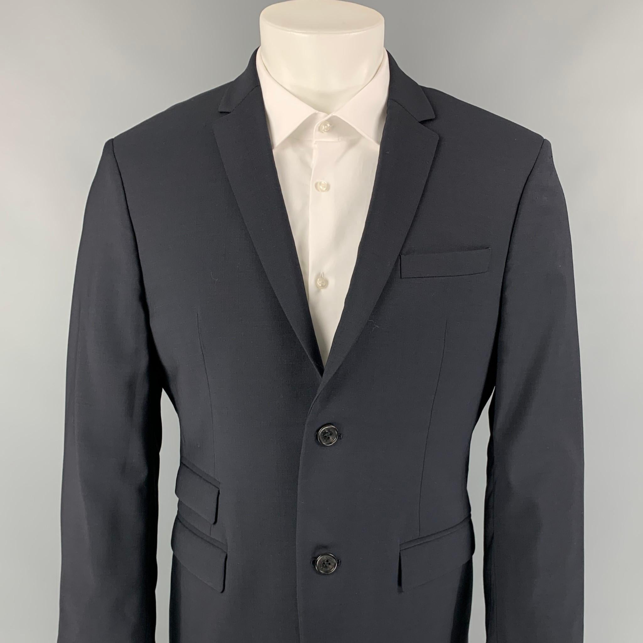 NEIL BARRETT sport coat comes in a navy wool with a full liner featuring a slim fit, notch lapel, double back vent, flap pockets, and a double button closure. Made in Italy. 

Very Good Pre-Owned Condition.
Marked: 50

Measurements:

Shoulder: 18