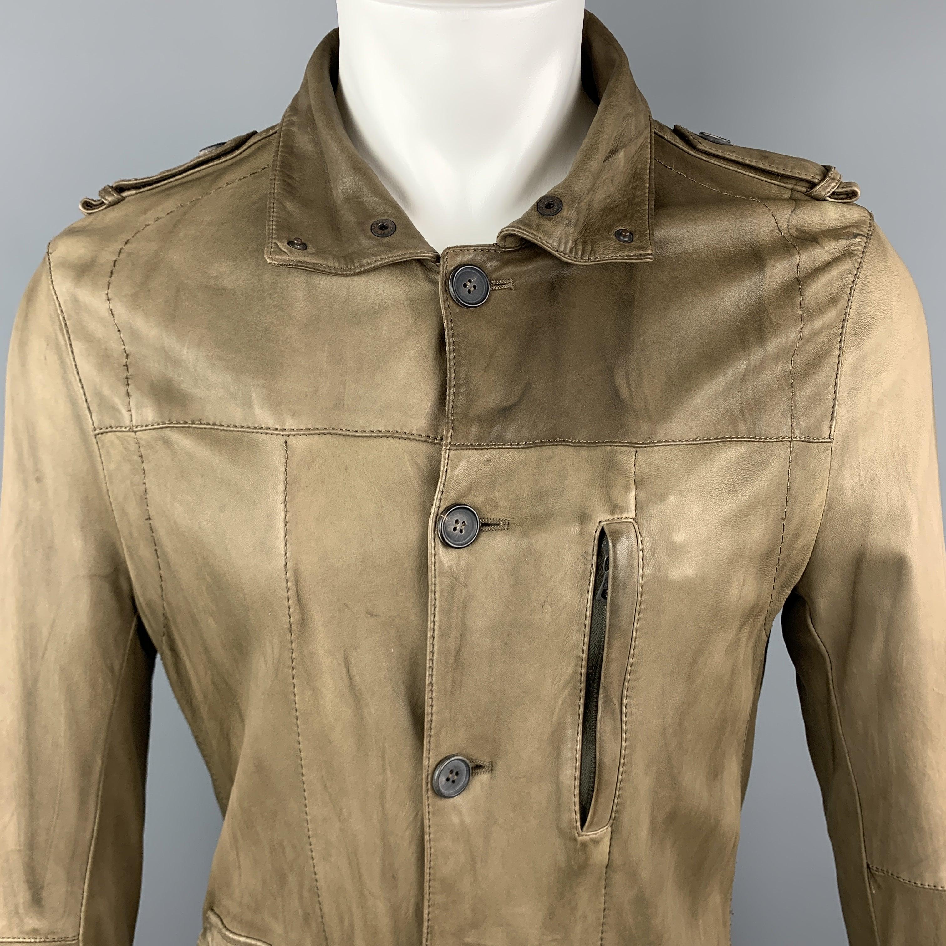 NEIL BARET jacket comes in light weight taupe leather with a folded snap collar, button up front, flap and zip pockets, epaulets, and top stitching. Wear throughout. Made in Italy.Good
Pre-Owned Condition. 

Marked:    

Measurements: 
 
Shoulder: