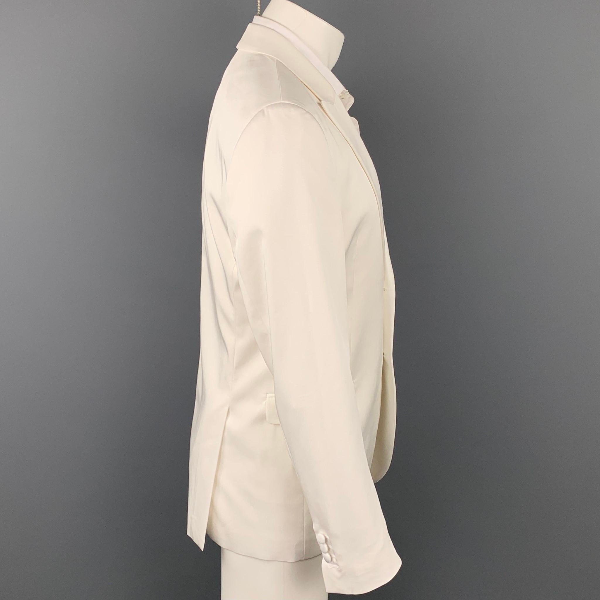 NEIL BARRETT sport coat comes in a white tencel blend with a full liner featuring a peak lapel, flap pockets, and a two button closure. Made in Italy.

Very Good Pre-Owned Condition.
Marked: IT 50

Measurements:

Shoulder: 18 in.
Chest: 40