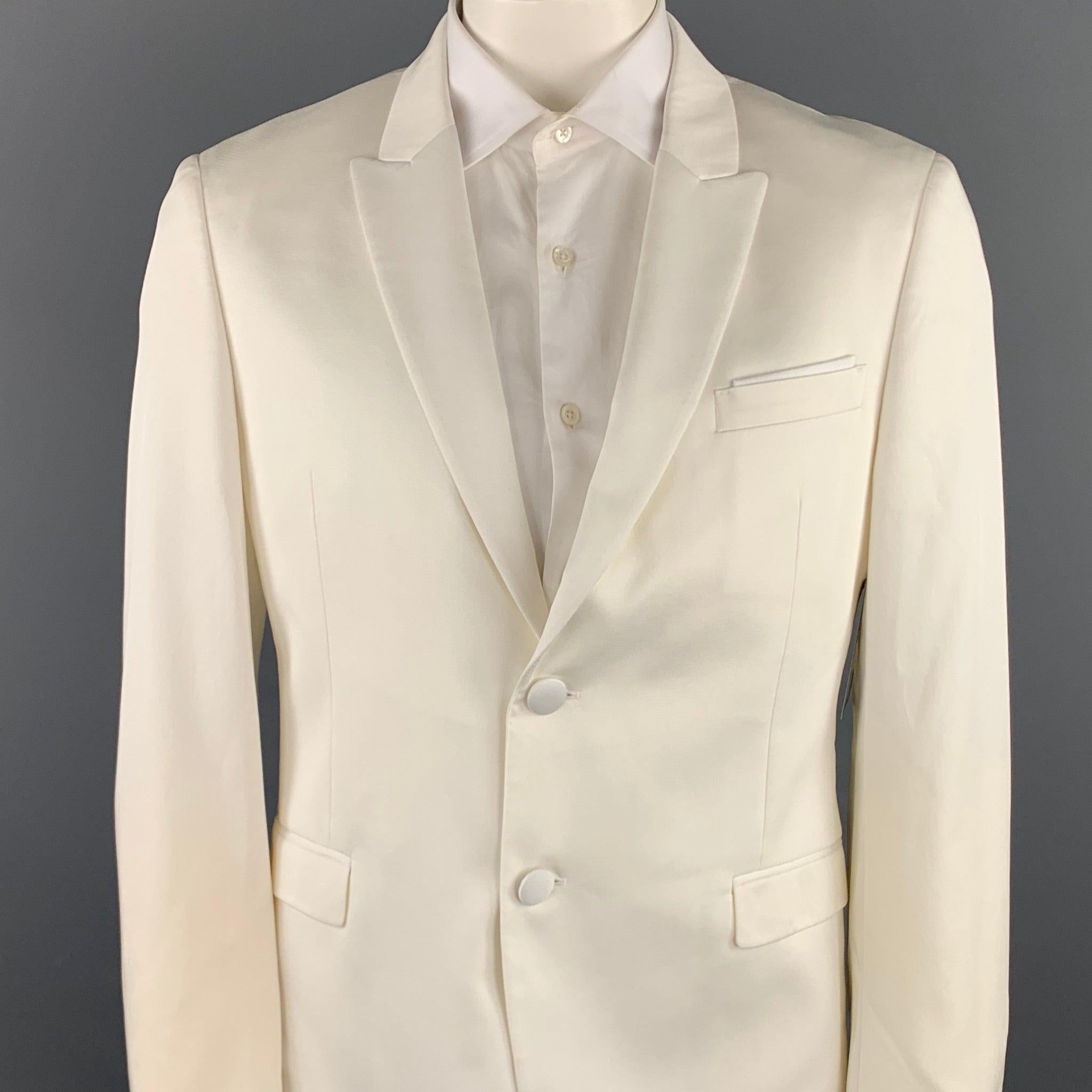 NEIL BARRETT sport coat comes in a white tencel blend with a full liner featuring a peak lapel, flap pockets, and a two button closure. Made in Italy.New With Tags. 

Marked:   IT 52 

Measurements: 
 
Shoulder: 18.5 inches 
Chest: 42 inches
