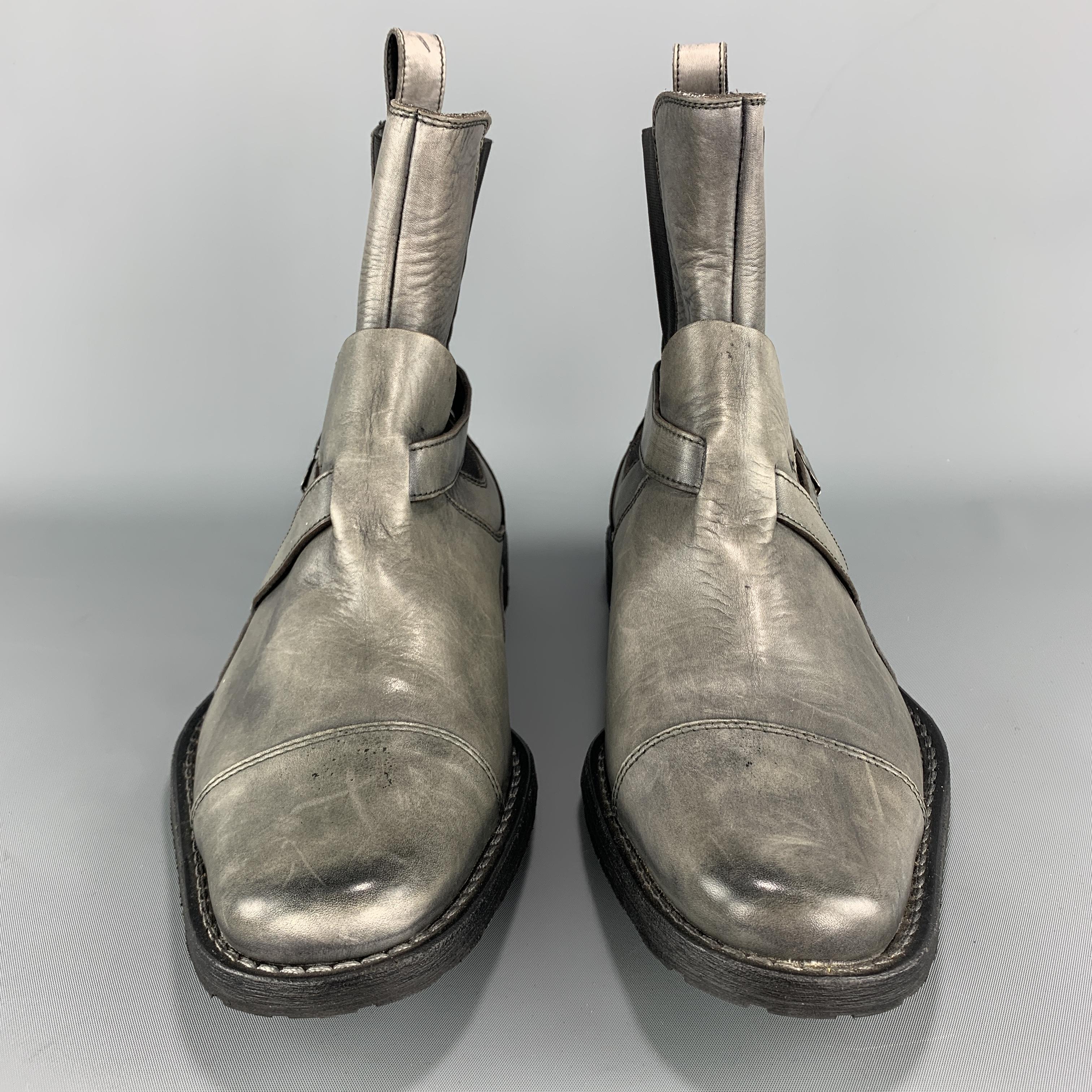 NEIL BARRETT chelsea ankle boots come in antique effect slate gray leather with a toe cap, elasticized sides, and buckled strap details. Made in Italy.

Excellent Pre-Owned Condition.
Marked: IT 40

Measurements:

Outsole: 11.75 x 4.5 in.
Height: