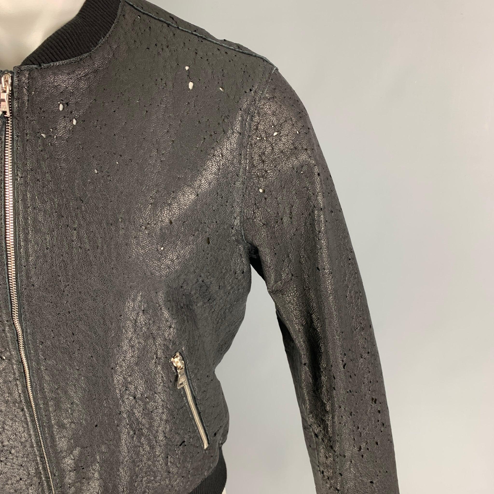 NEIL BARRETT jacket comes in a black distressed goat leather with a white liner featuring a bomber style, skinny fit, ribbed hem, zipper pockets, and a zip up closure. Made in Italy.
New With Tags.  

Marked:   L  

Measurements: 
 
Shoulder: 18