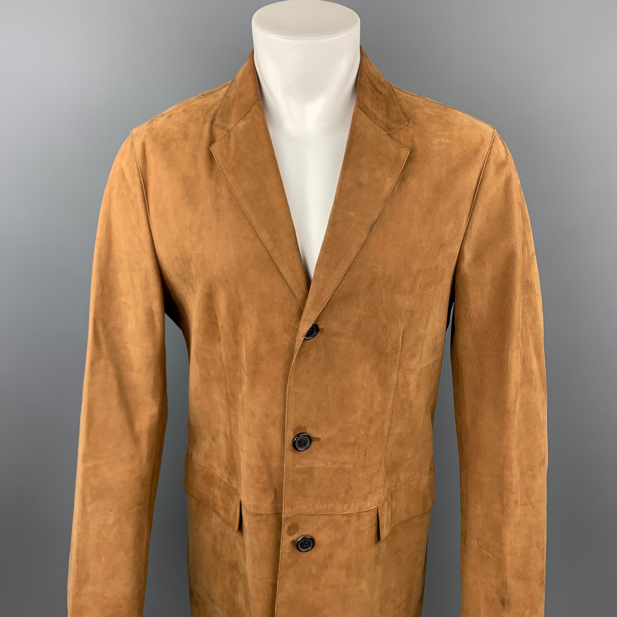 NEIL BARRETT coat comes in a brown leather featuring a notch lapel, flap pockets, and a buttoned closure. Wear on sleeve. Made in Italy.

Good Pre-Owned Condition.
Marked: M

Measurements:

Shoulder: 18.5 in. 
Chest: 42 in. 
Sleeve: 27 in. 
Length: