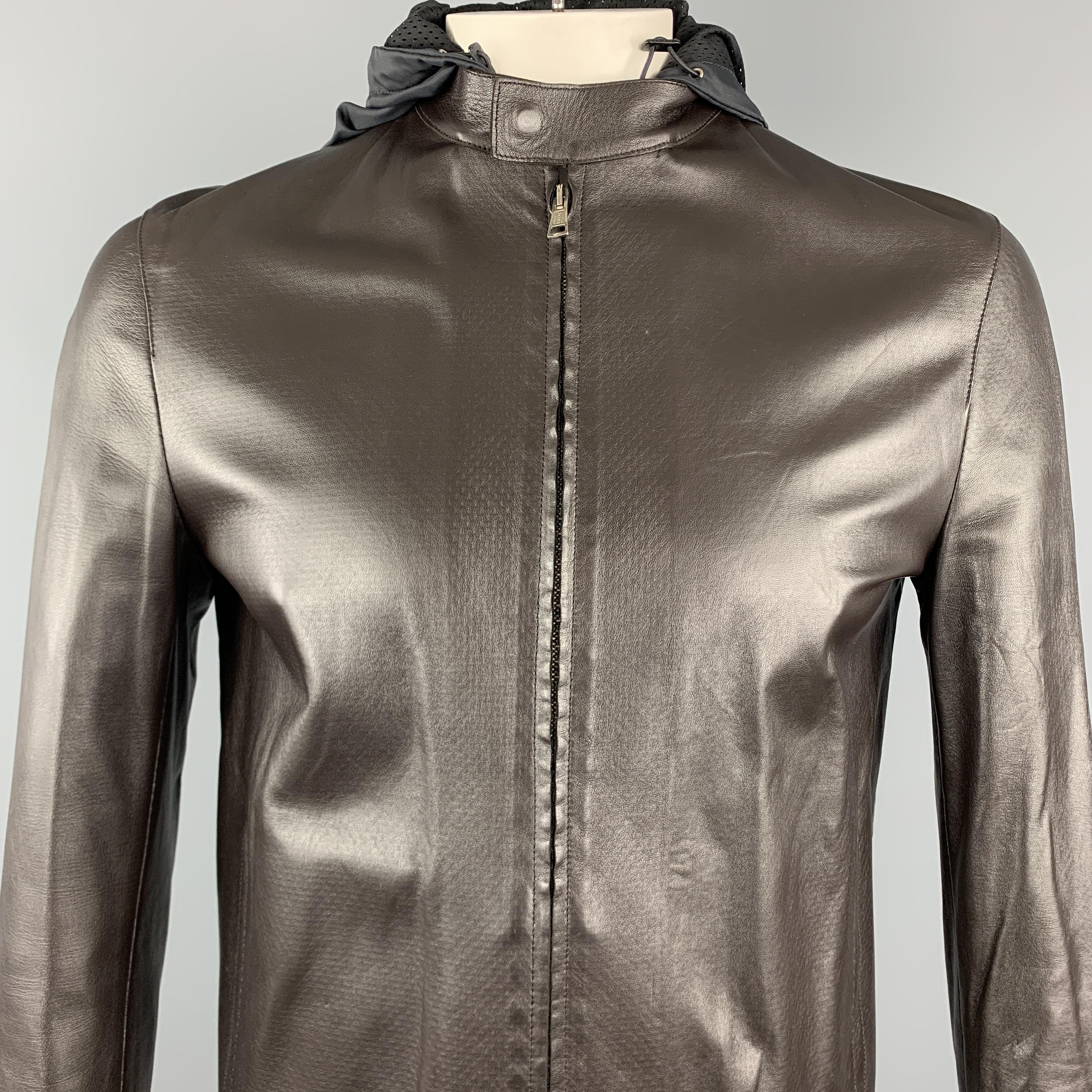 NEIL BARRETT motorcycle style jacket comes in light weight brown leather with mesh liner, tab collar, slit pockets, zip cuffs, and zip off hood. Made in Italy.

Excellent Pre-Owned Condition.
Marked: M

Measurements:

Shoulder: 17 in.
Chest: 44