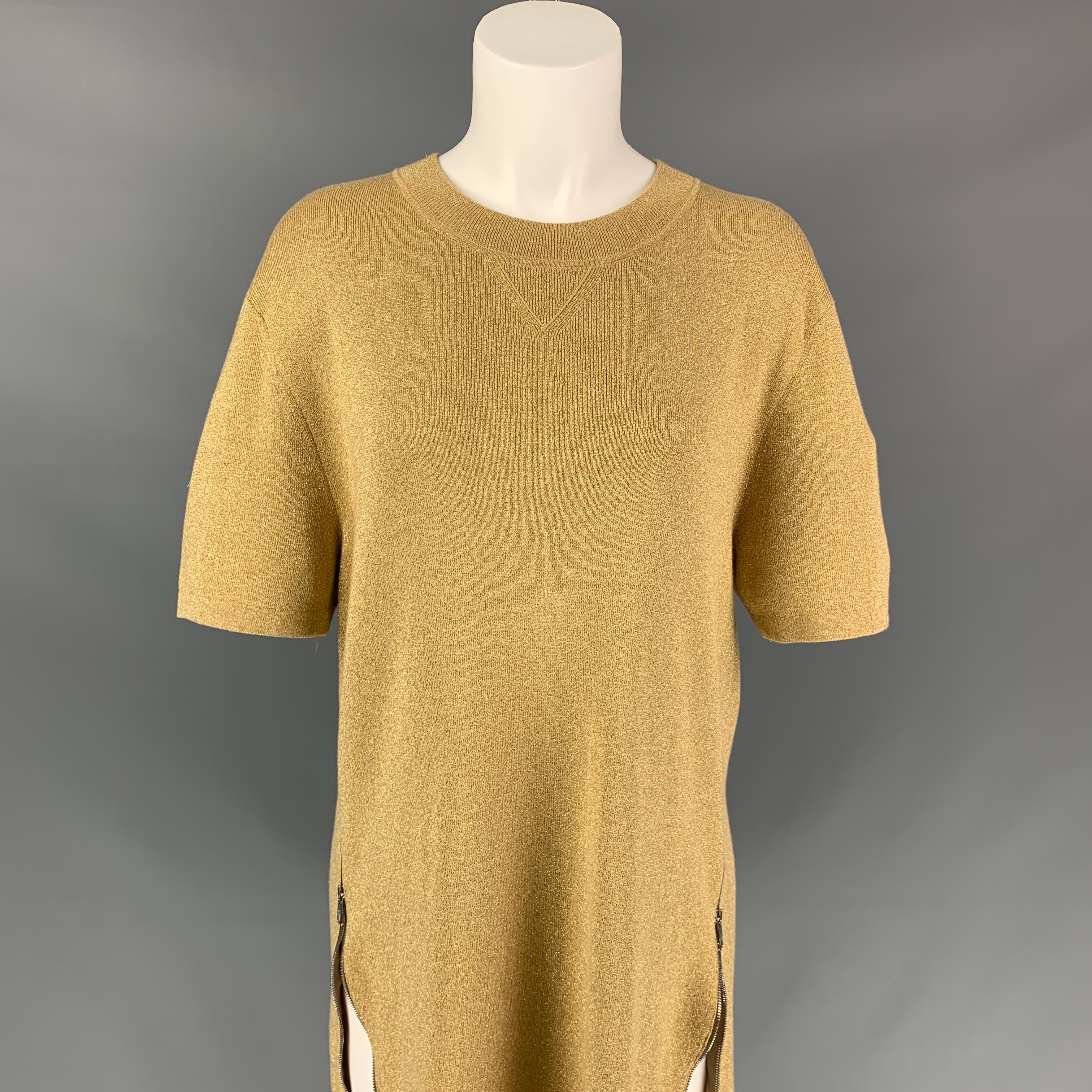 NEIL BARRETT pullover comes in a gold metallic polyester blend featuring a straight fit, side zippers, short sleeves, and a crew-neck. 

Very Good Pre-Owned Condition.
Marked: M

Measurements:

Shoulder: 19.5 in.
Bust: 38 in.
Sleeve: 10 in.
Length: