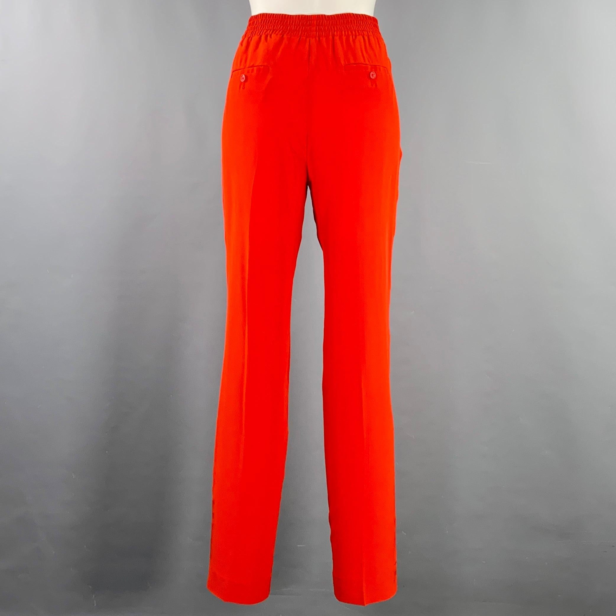 NEIL BARRETT casual pants
in a red silk featuring a straight leg, masculine fit, and elastic waistband. Made in Italy.New with Tags. 

Marked:   IT 42 

Measurements: 
  Waist: 30 - 35 inches Rise: 9.5 inches Inseam: 31 inches 
  
  
 
Sui Generis