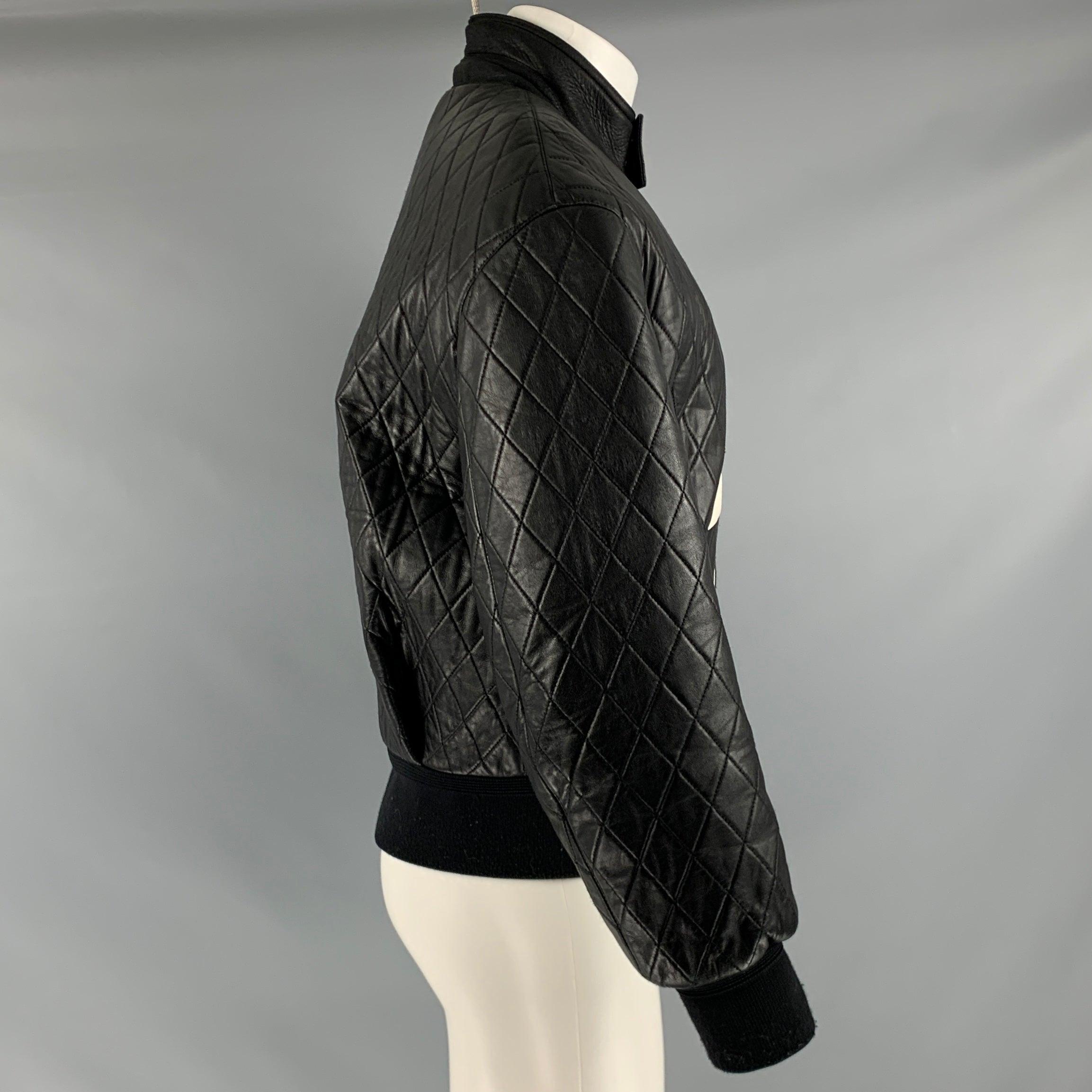 NEIL BARRETT jacket
in a black and white leather fabric featuring a quilted style, oversized bomber fit, lightning bolt design, and zip up closure. Made in Italy.Very Good Pre-Owned Condition. Minor signs of wear. 

Marked:   S 

Measurements: 

