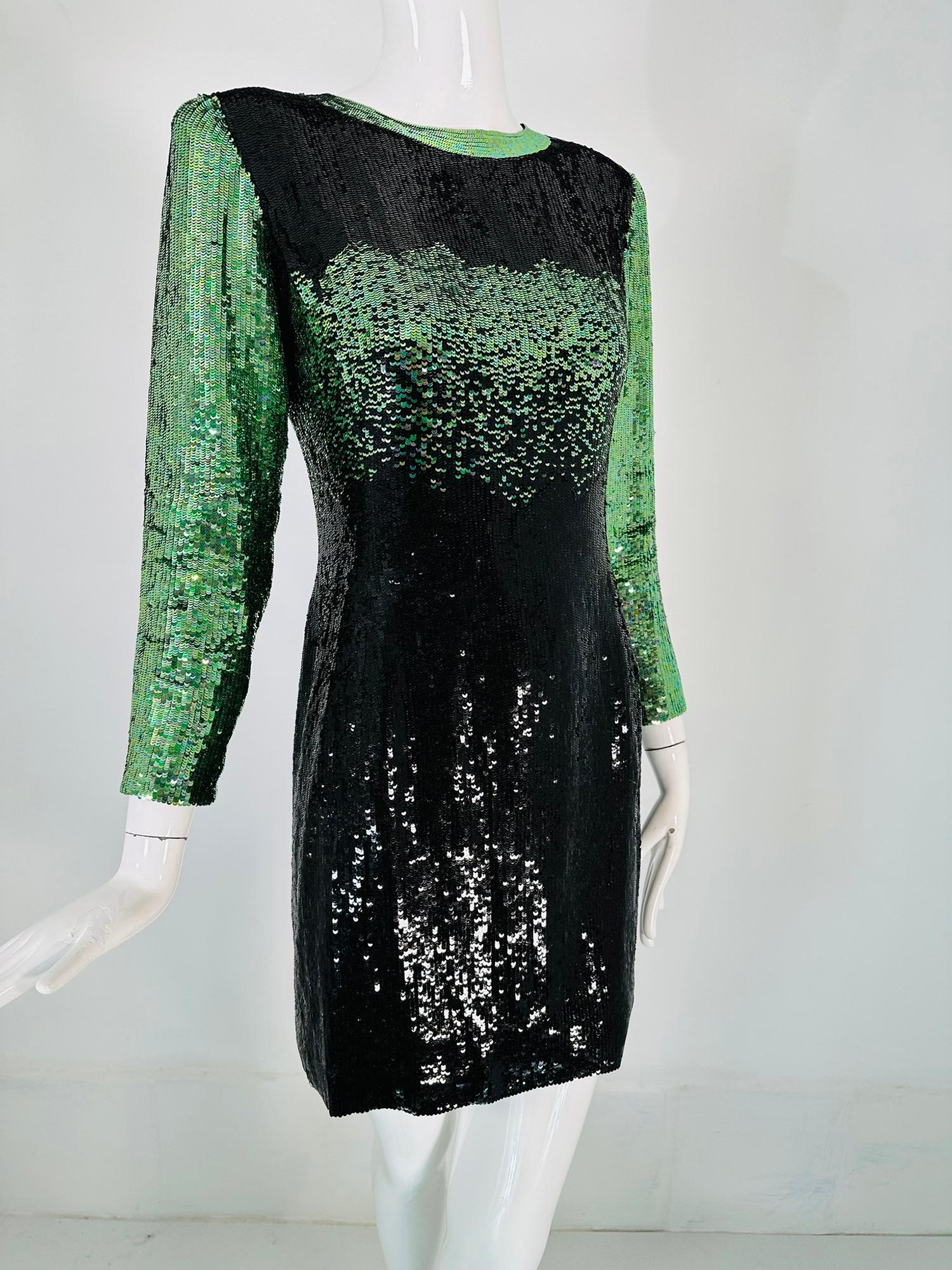 Neil Beiff black & green totally sequined cocktail dress. Take center stage at your next evening event in this sparking dress from Neil Beiff. Every surface is covered in glittering sequins. Round neckline dress with long sleeves and a straight cut