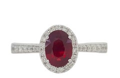 Neil Lane 1 Carat Oval Ruby and 0.5 Carat Diamond Halo Engagement Ring