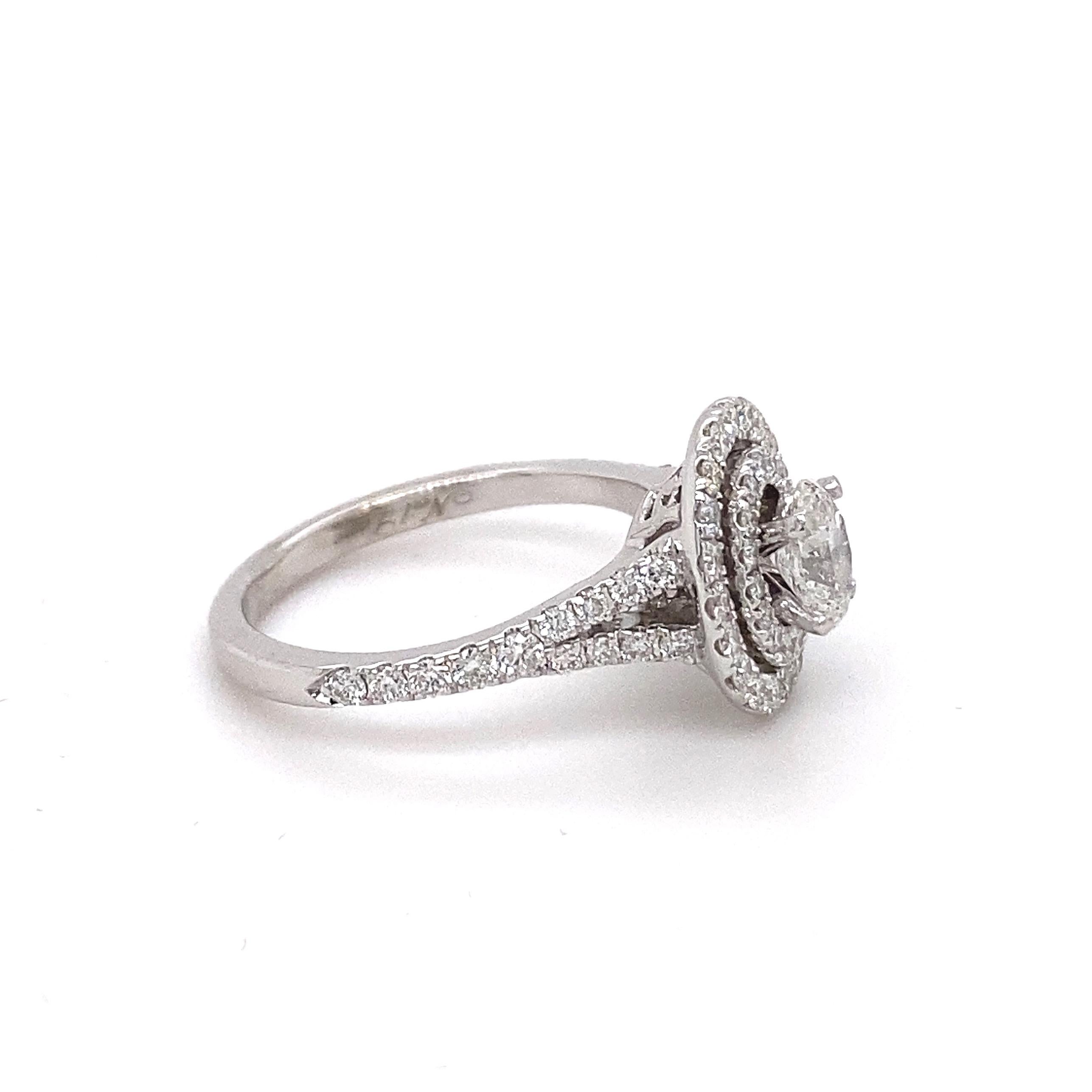 Neil Lane Bridal Oval Diamond Engagement Ring
Style:  Double Halo
Metal:  14kt White Gold
Size:  6 - sizable
TCW:  1.00 tcw
Main Diamond:  Oval Cut Diamond 0.50 cts
Color & Clarity:  I, I1
Accent Diamonds:   62 Round Brilliant Diamonds 0.50